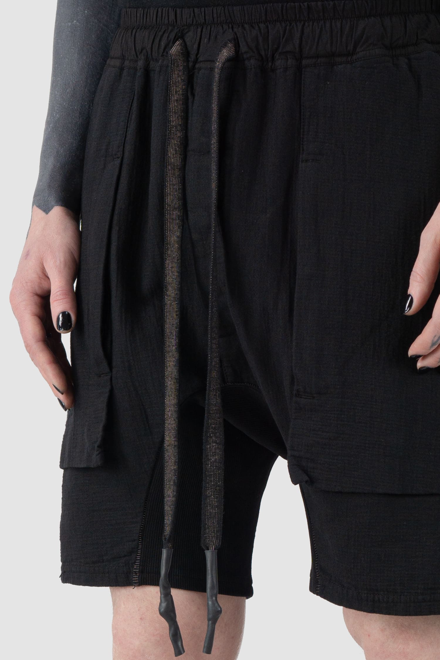 69 by Isaac Sellam - front detail view of Black Organic Cotton Zip Cargo Sweat Shorts