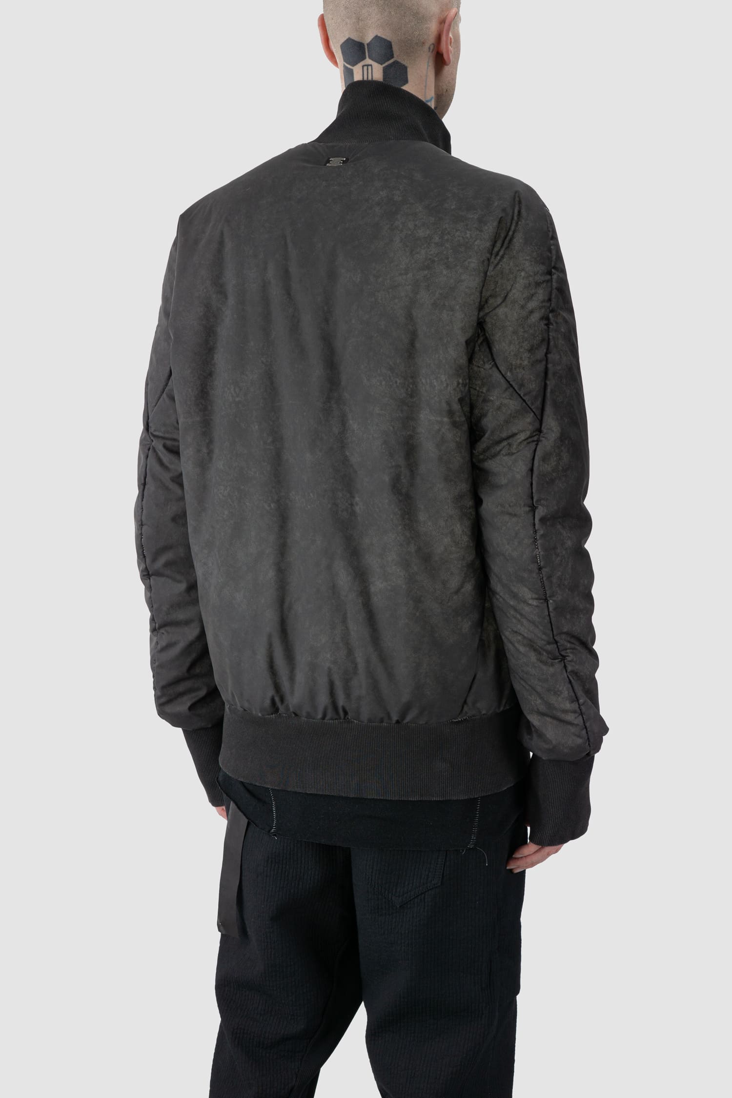 69 by Isaac Sellam - back side view of grey Reflective Object-Dyed Padded Nylon Bomber Jacket