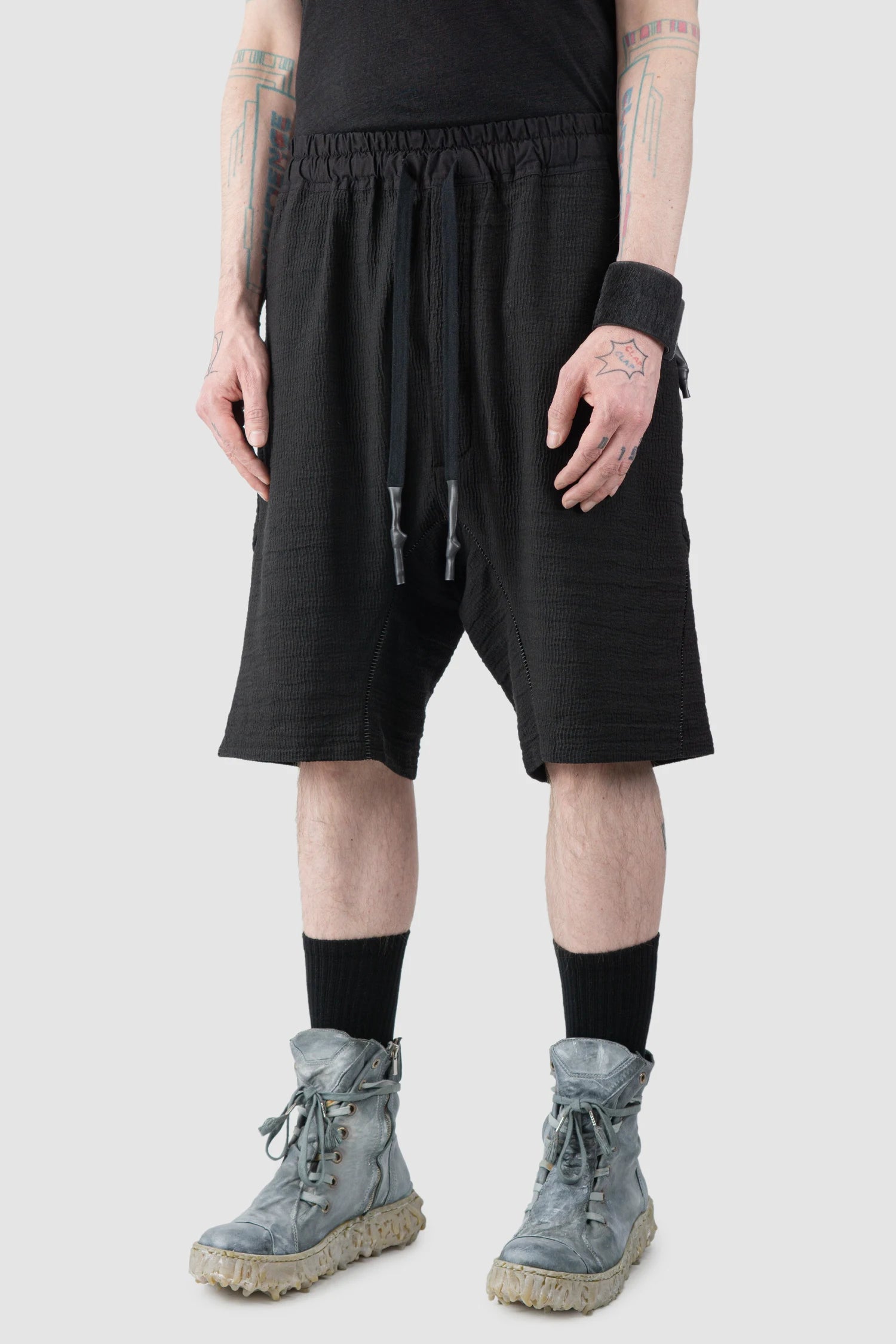 69 by Isaac Sellam - Men’s Black Drop Crotch Hidden Pocket Cotton Shorts model front side view