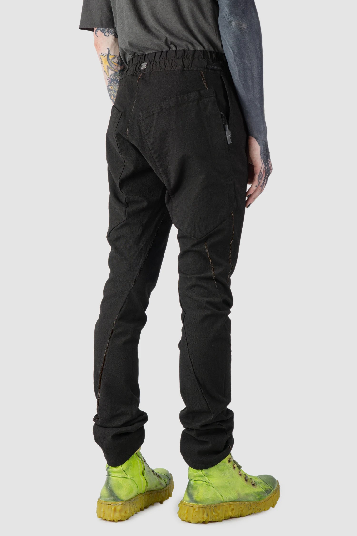 69 by Isaac Sellam - model back view of Black Fitted Cotton Cargo Trousers