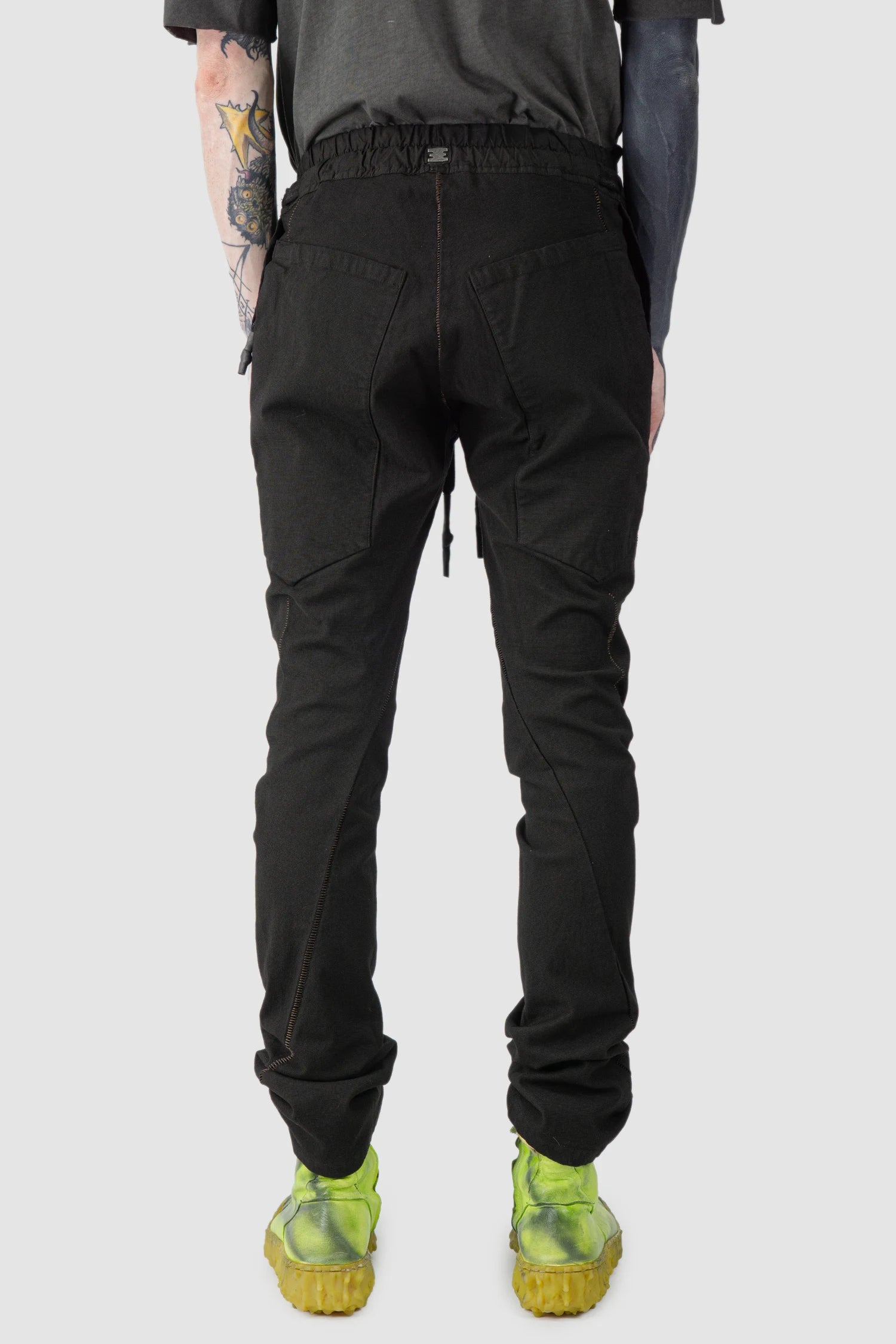 69 by Isaac Sellam - model back view of Black Fitted Cotton Cargo Trousers