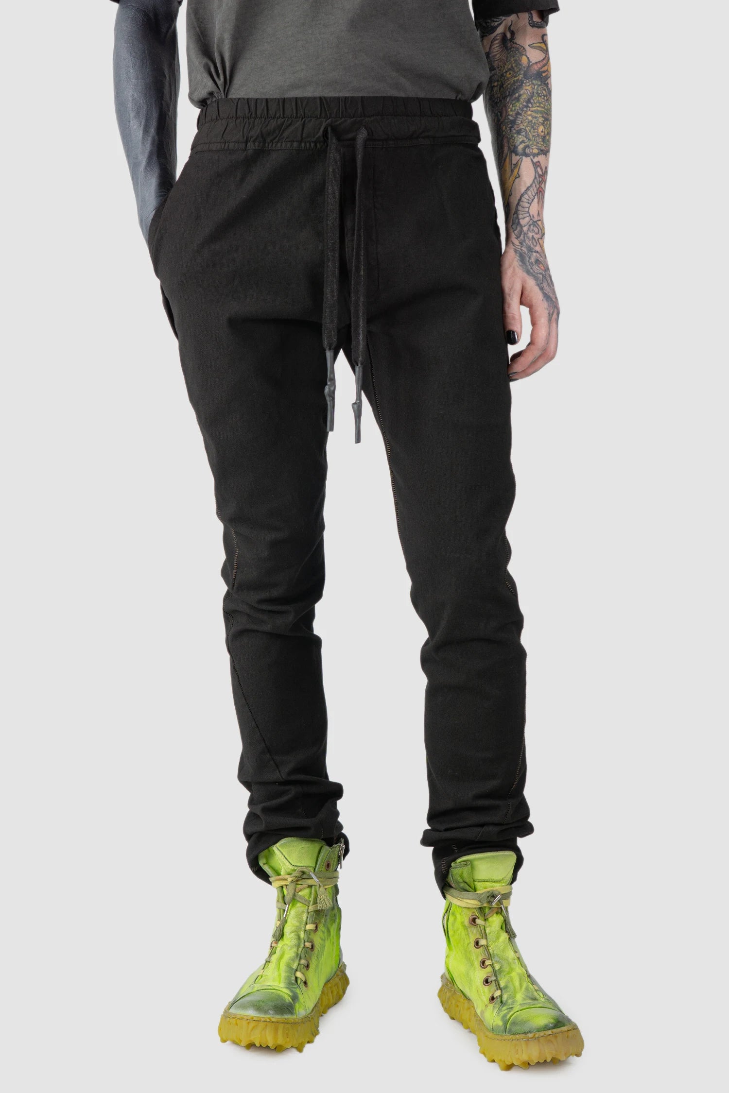 69 by Isaac Sellam - model front relaxed view of Black Fitted Cotton Cargo Trousers