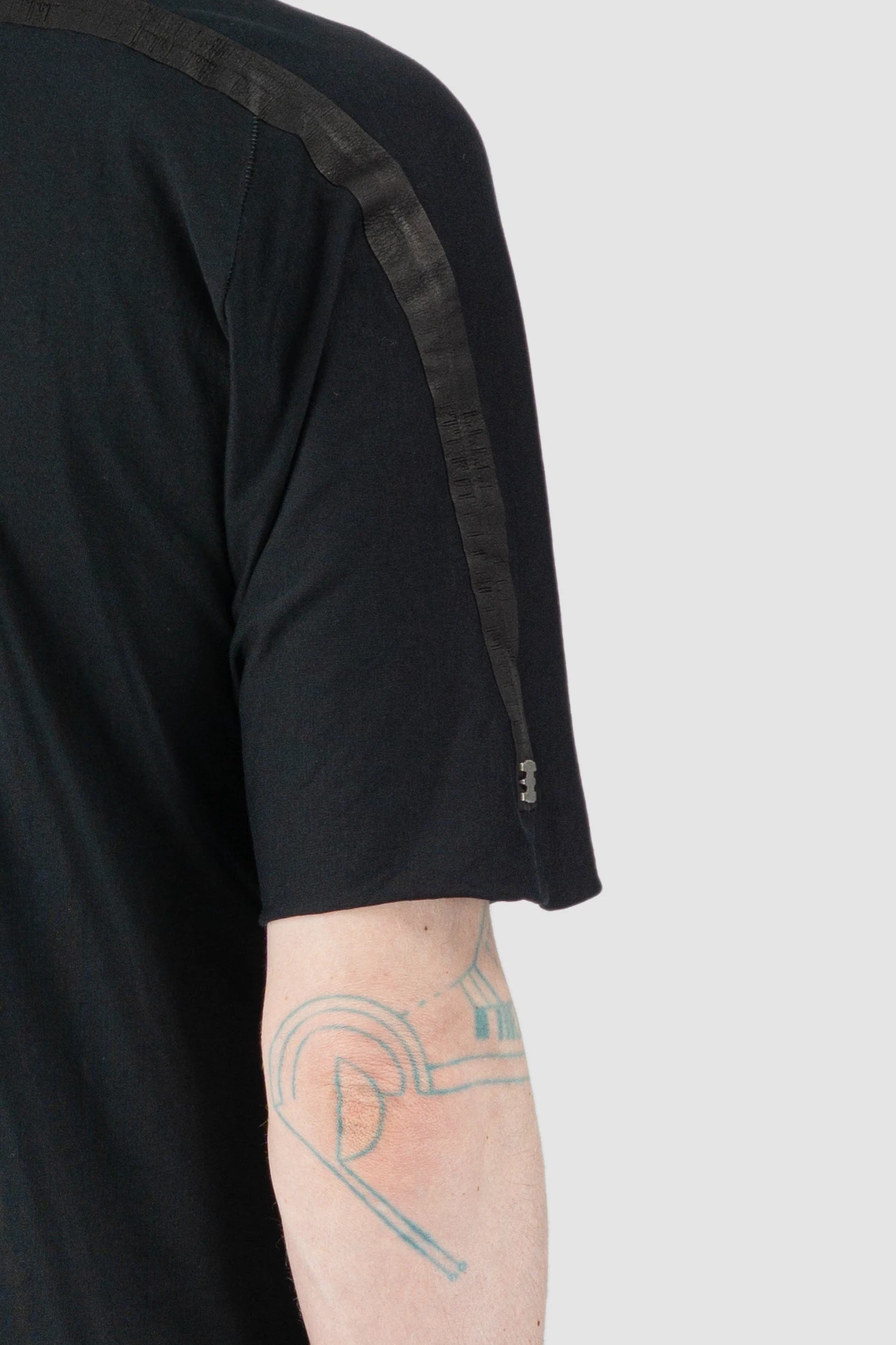 69 by Isaac Sellam - Men’s Black Organic Cotton T-Shirt with Leather Details metal detail view