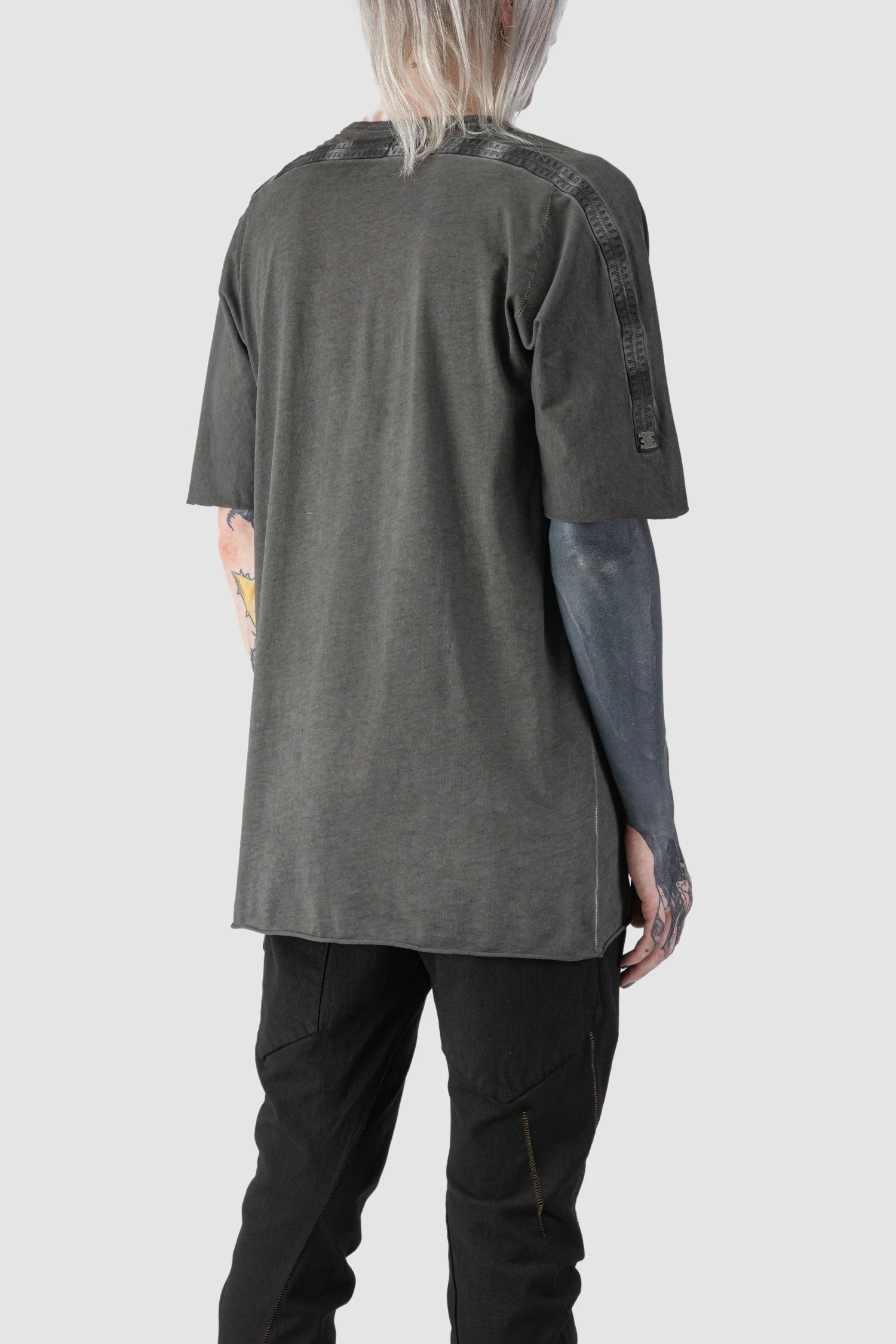 69 by Isaac Sellam - model back side view of Grey Object Dyed Leather Spine Short Sleeve Tee