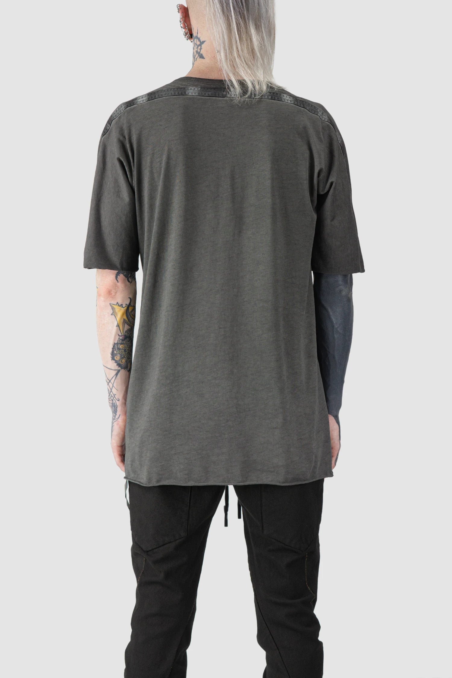 69 by Isaac Sellam - model back view of Grey Object Dyed Leather Spine Short Sleeve Tee