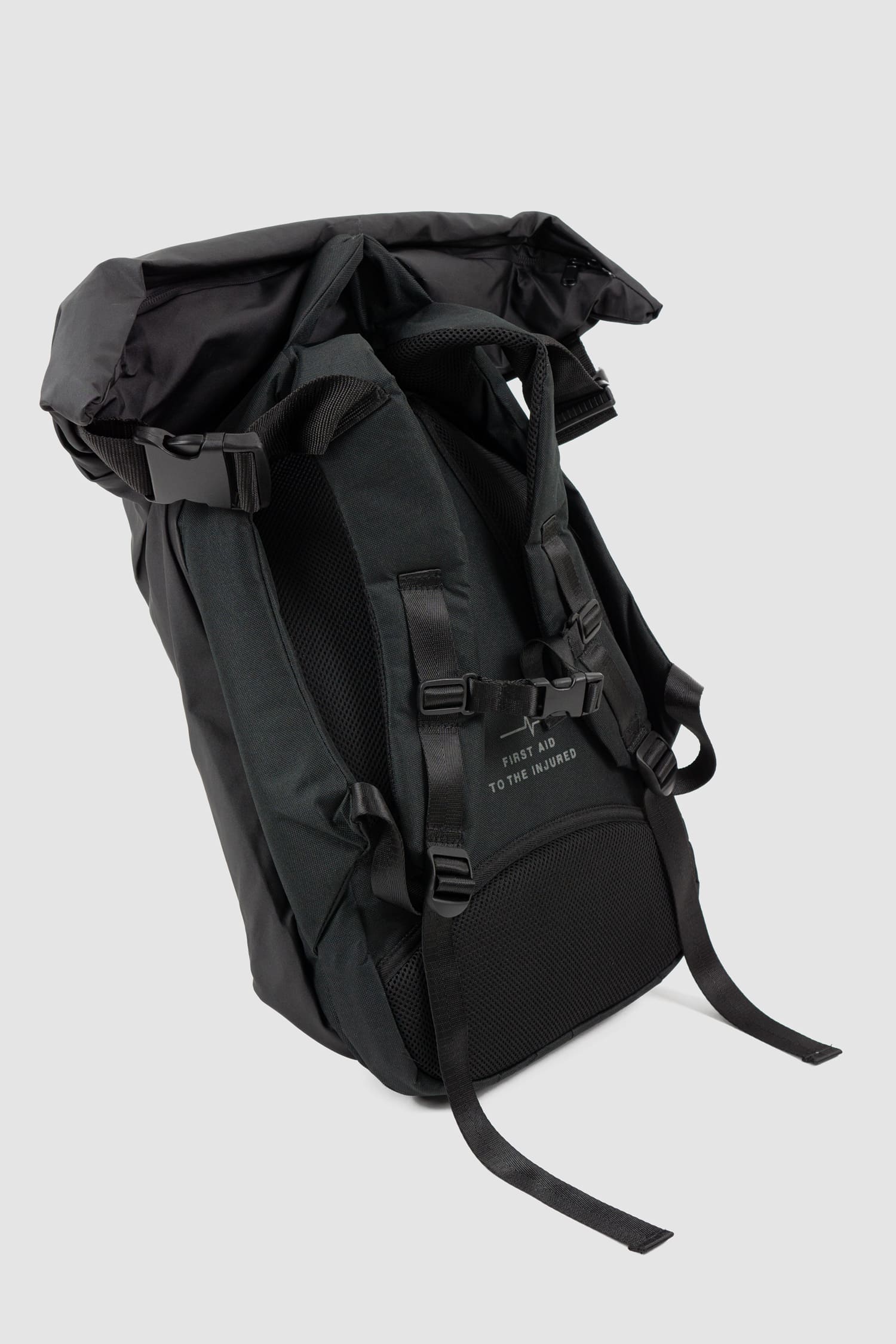 First Aid to the Injured - solo right view of black -Crash against the shore- utility backpack.