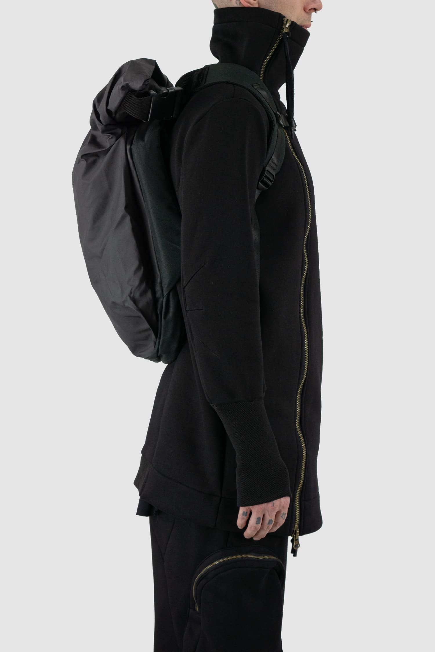 First Aid to the Injured - right side view of black -Crash against the shore- utility backpack.