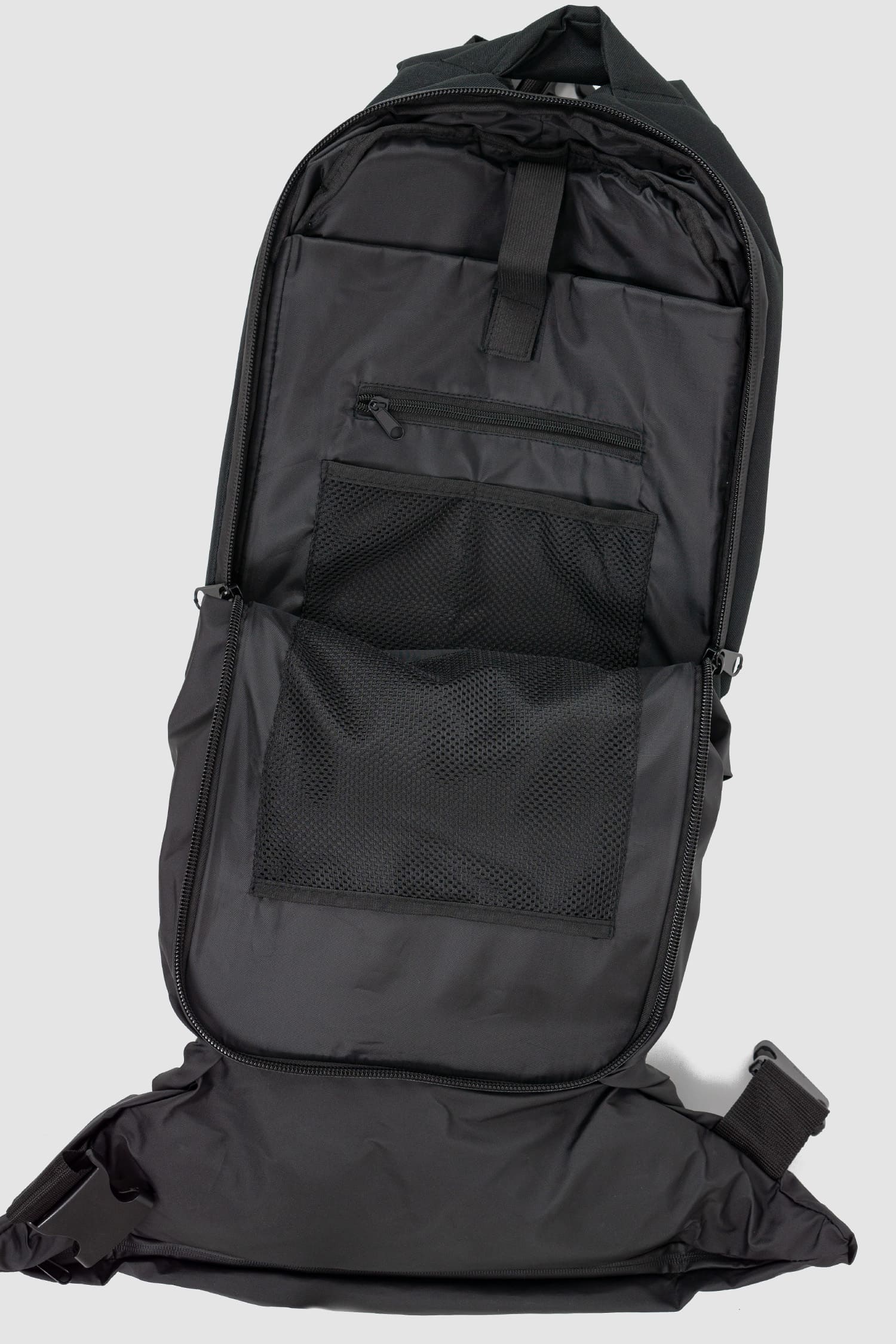 First Aid to the Injured - front open view of black -Crash against the shore- utility backpack.