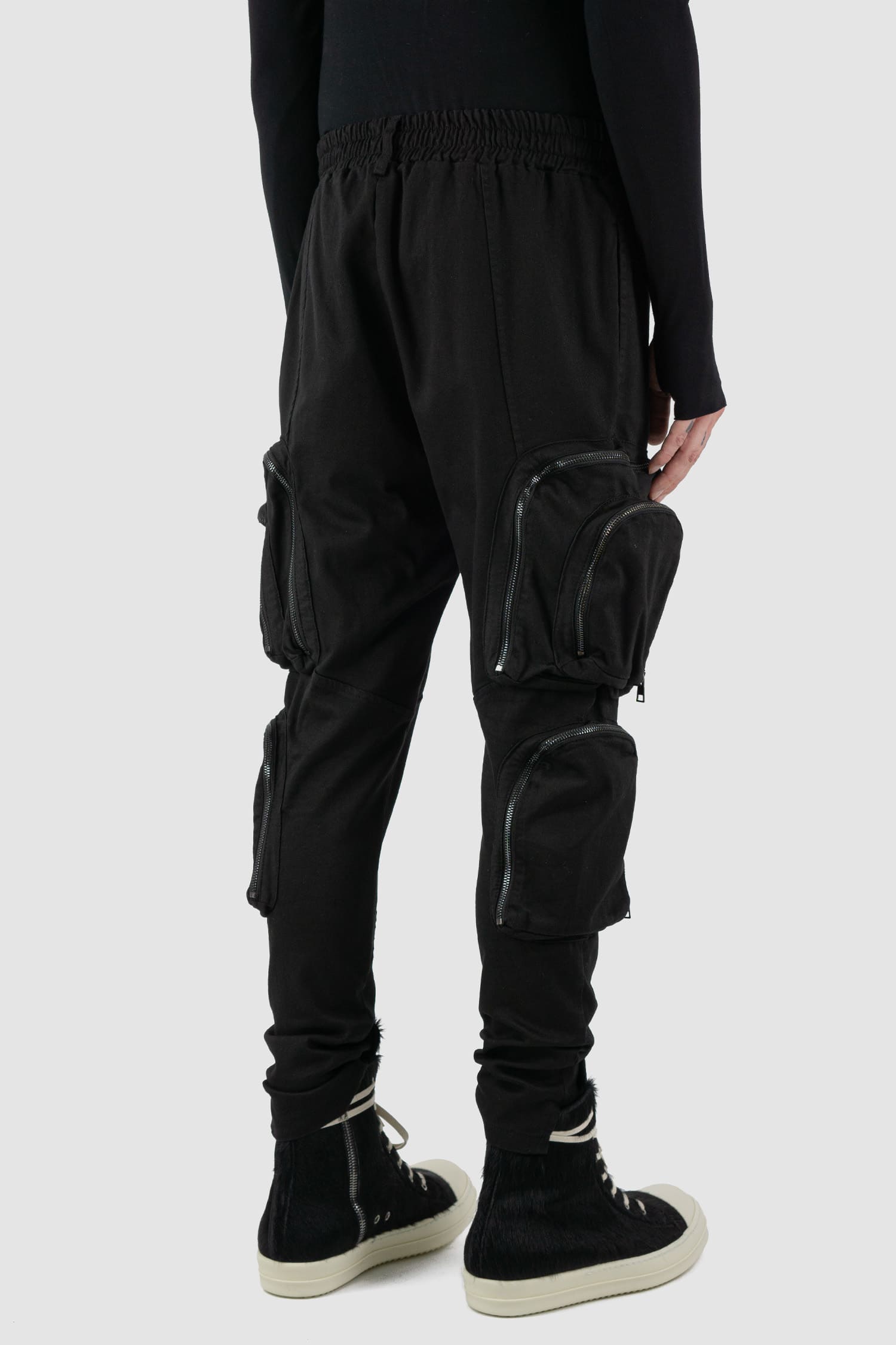 La Haine Inside Us - bag side view of black cargo trousers with zipper for men from the FW24 collection made of warm dyed cotton.