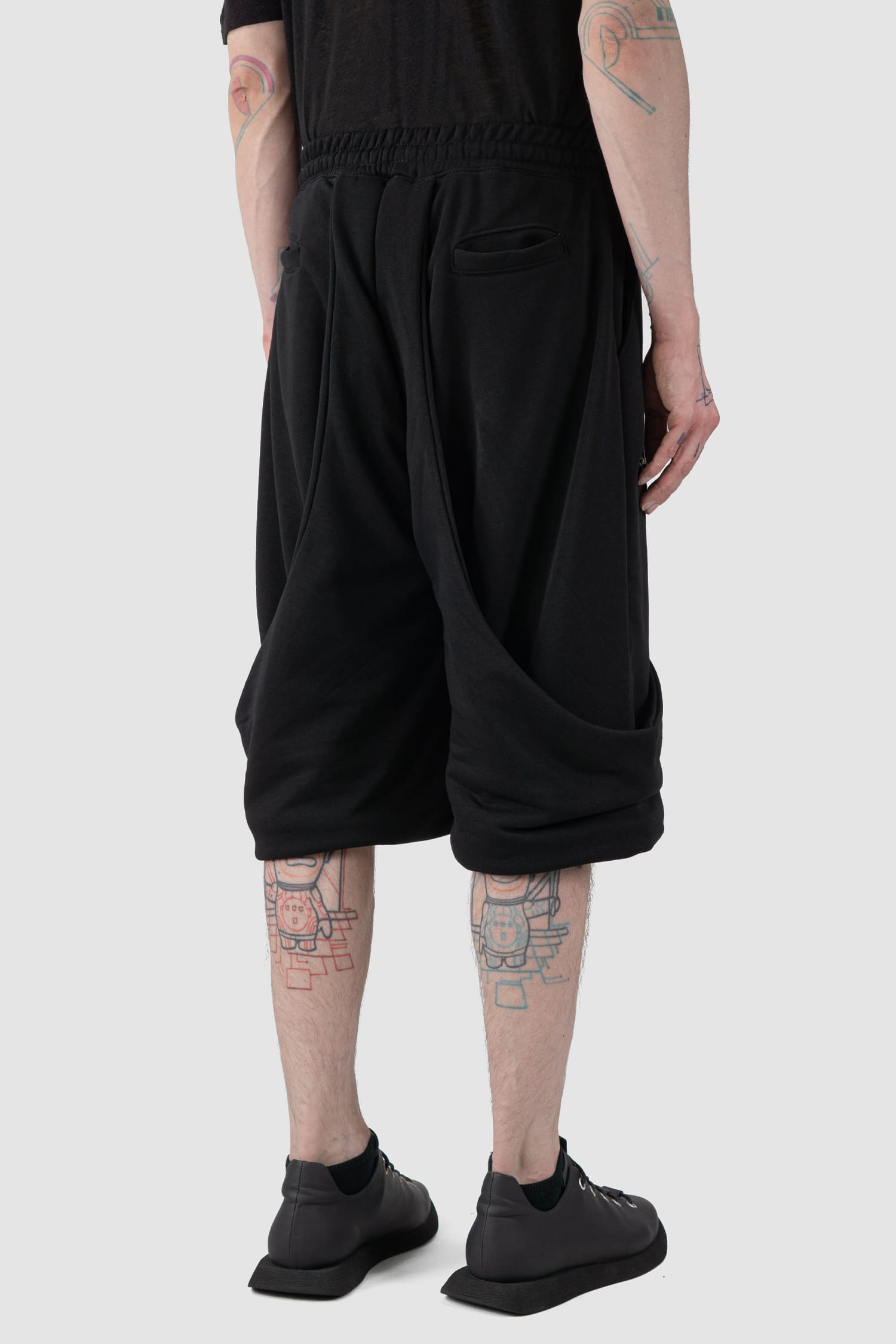 La Haine Inside Us - back side view of black Relaxed Wrapped Panel Sweat Shorts