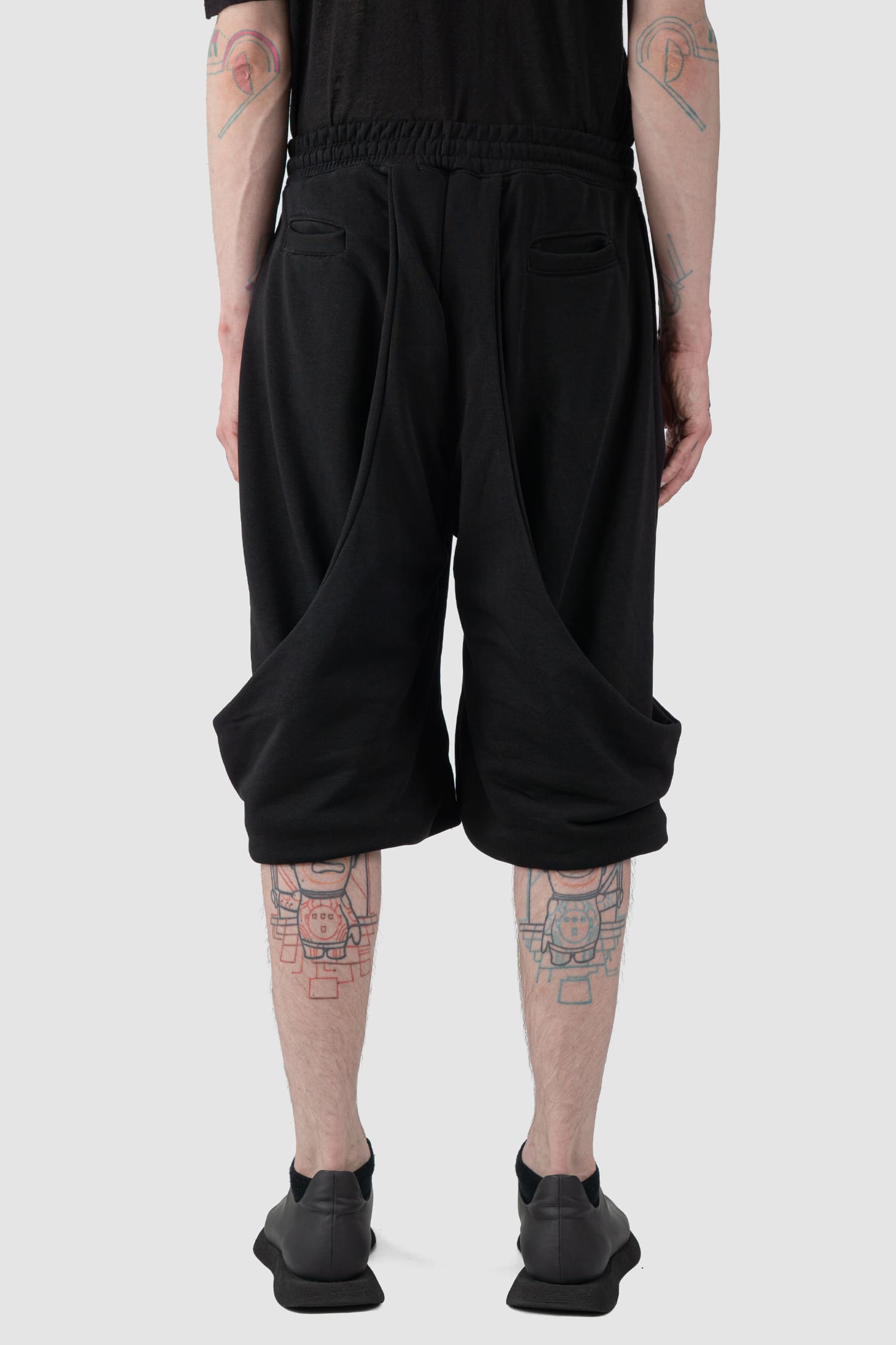 La Haine Inside Us - back view of black Relaxed Wrapped Panel Sweat Shorts