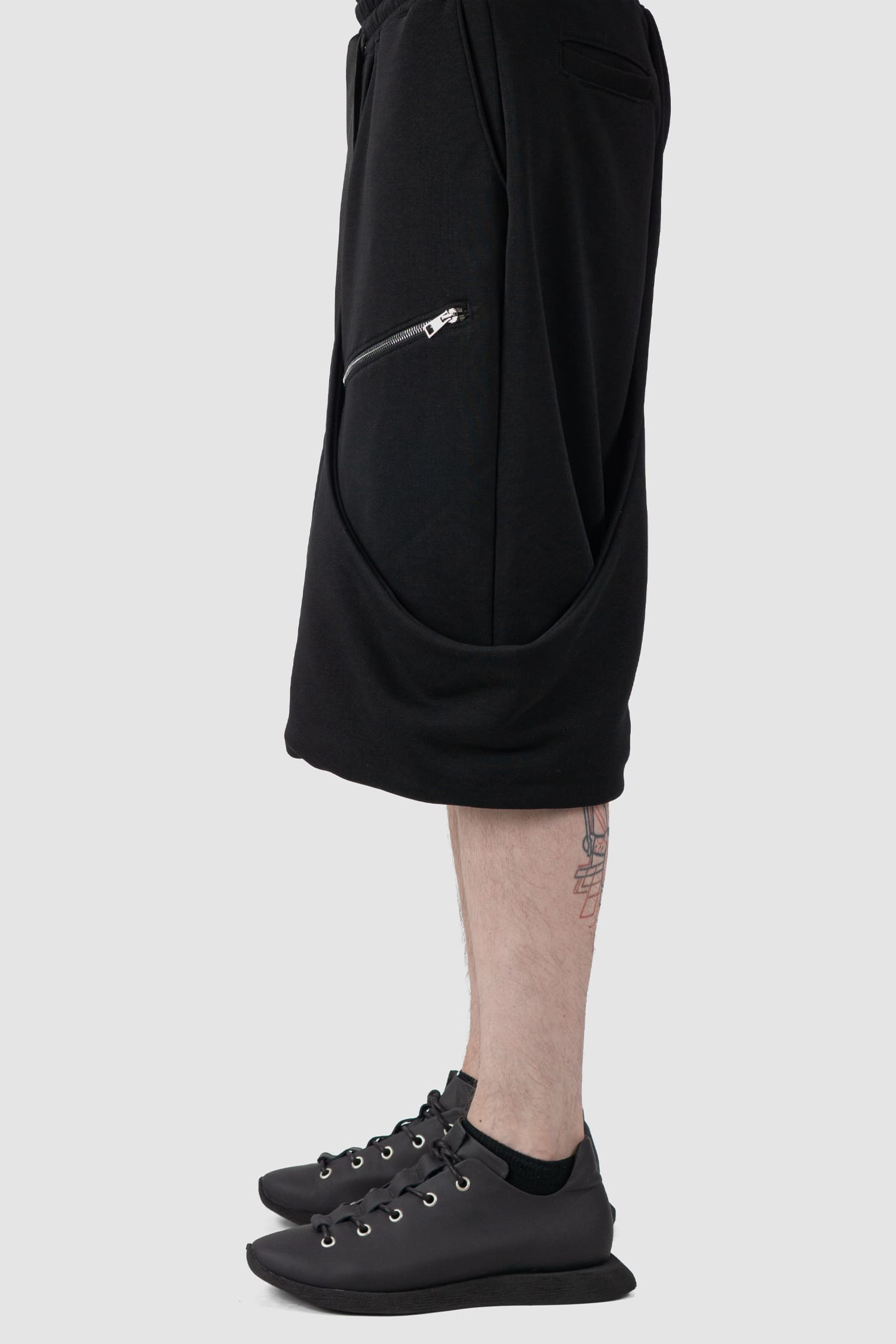 La Haine Inside Us - side view of black Relaxed Wrapped Panel Sweat Shorts