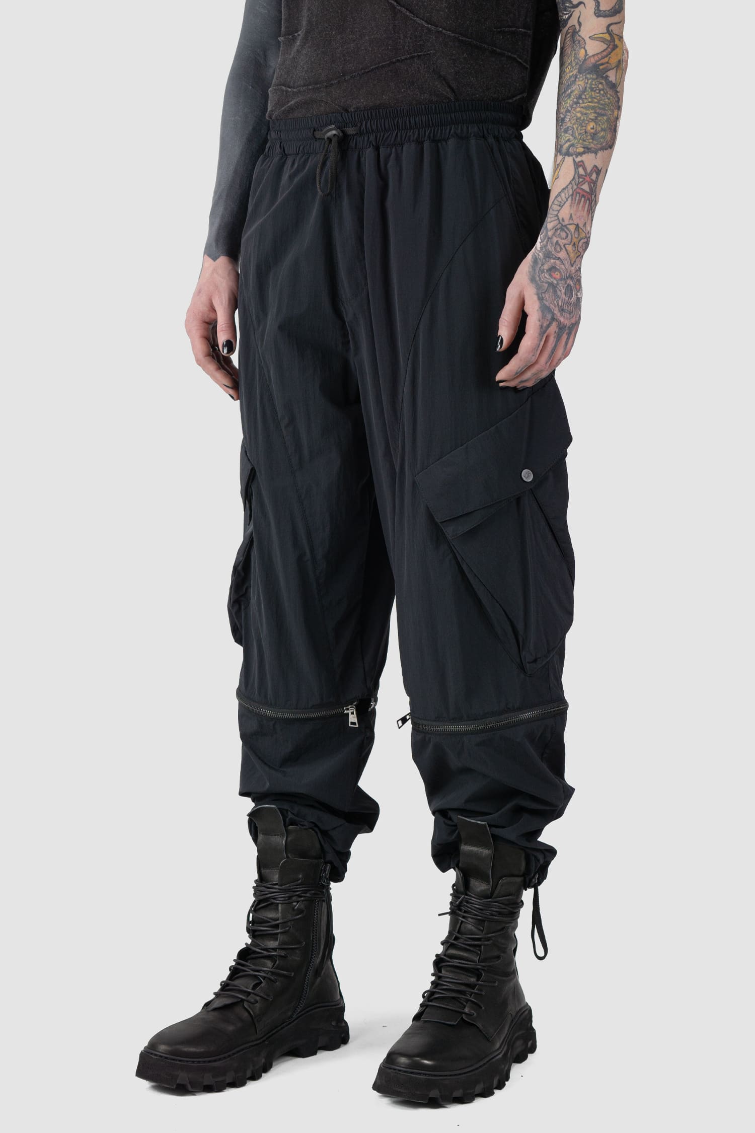 La Haine Inside us - front right side view of Black Utility Transform Cargo Pocket Trousers