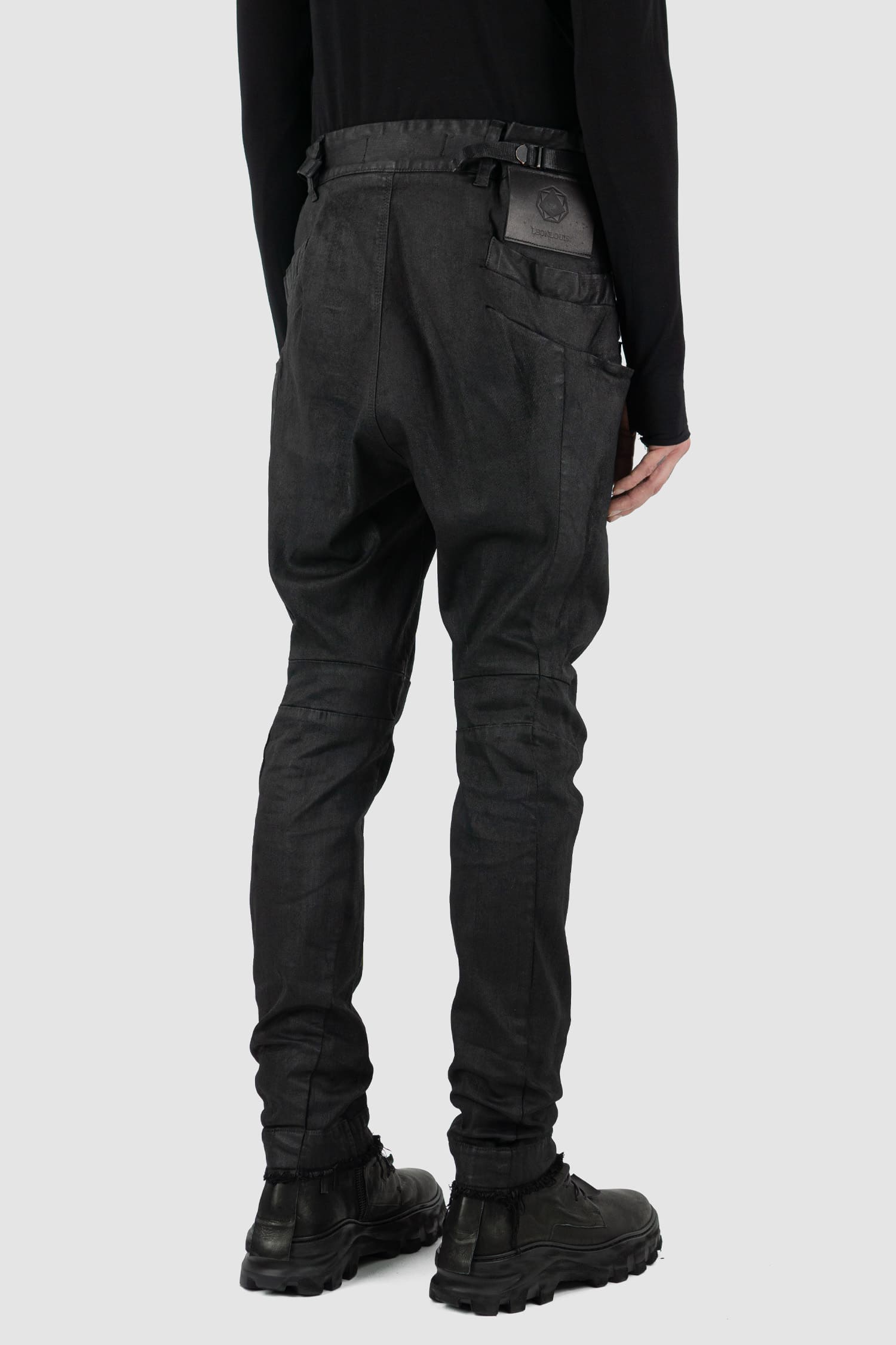 Leon Louis - back side view of black waxed Xeon shaped line denim jeans, slim fit, men's Permanent Collection.