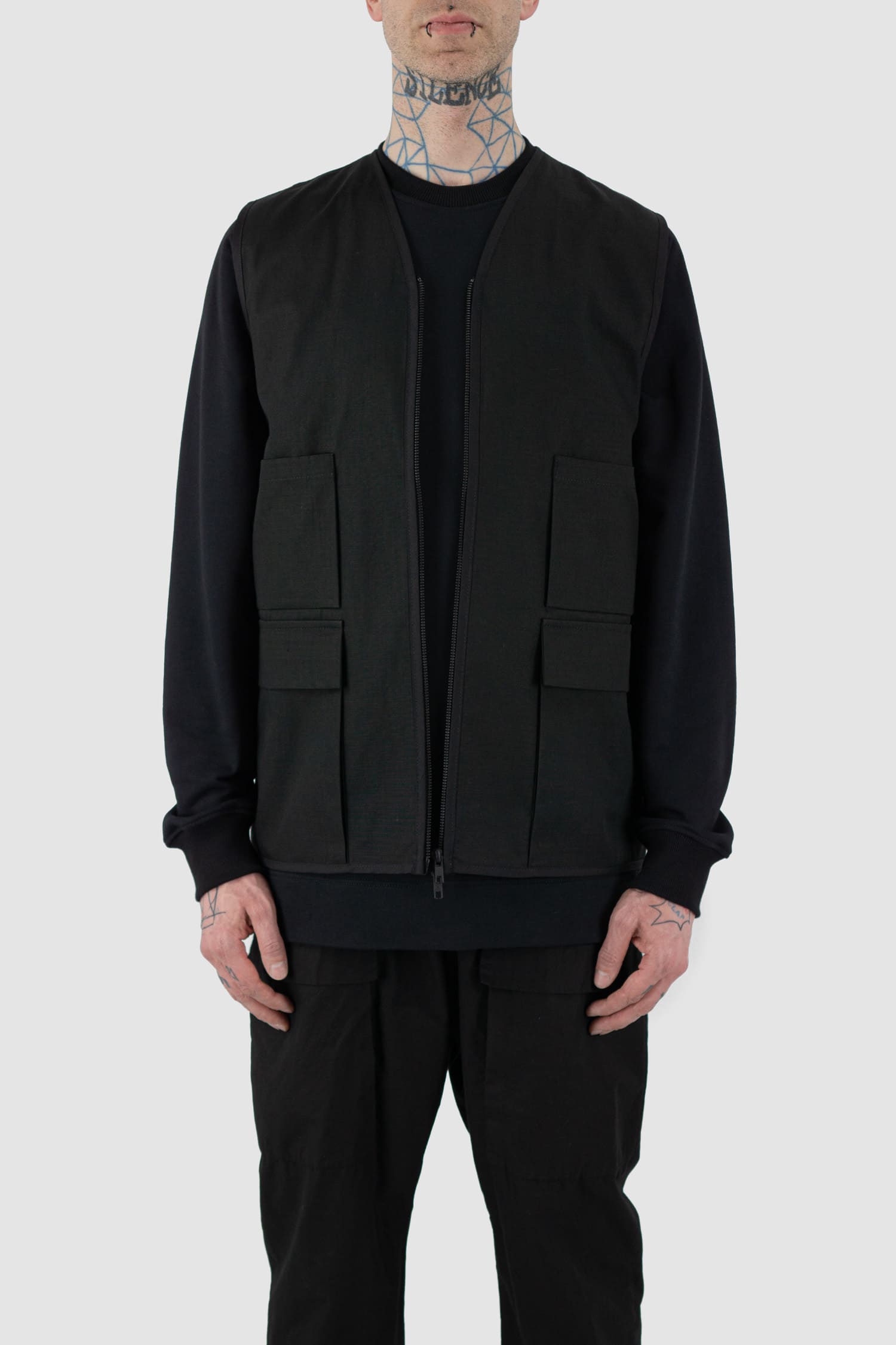 Nomen Nescio - Front open view of black cotton field vest with multiple pockets, zip fastening, loose fit.