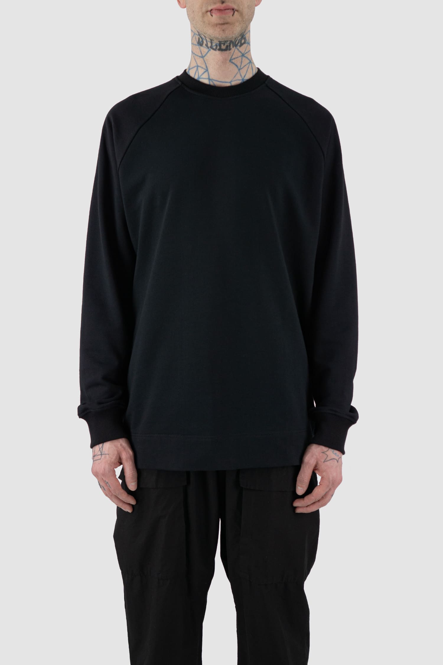 Nomen Nescio - Front view of black cotton raglan sweater with wool rib detail, spacious relaxed fit.