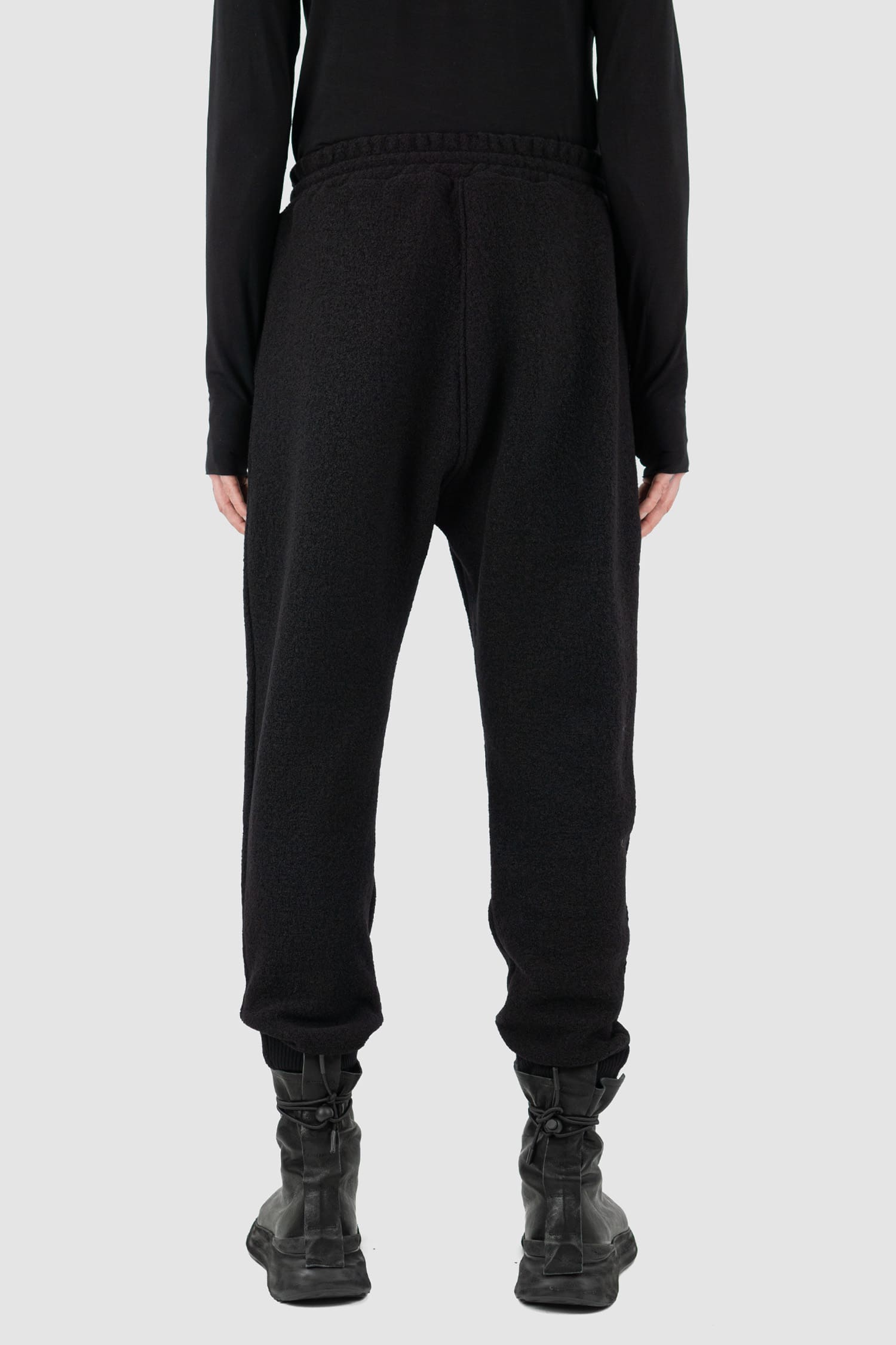 Nomen Nescio - back view of black woolen sweatpants with elastic waistband, recycled wool, for men.