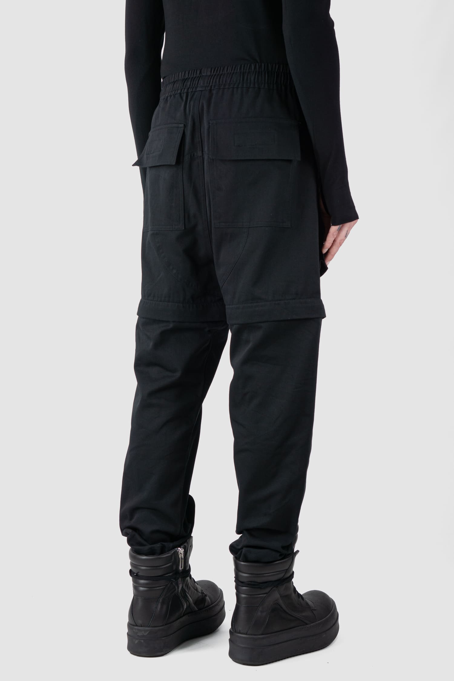 Ovnnie - back side regular view of the black Multifunctional Flared Pants NL12.