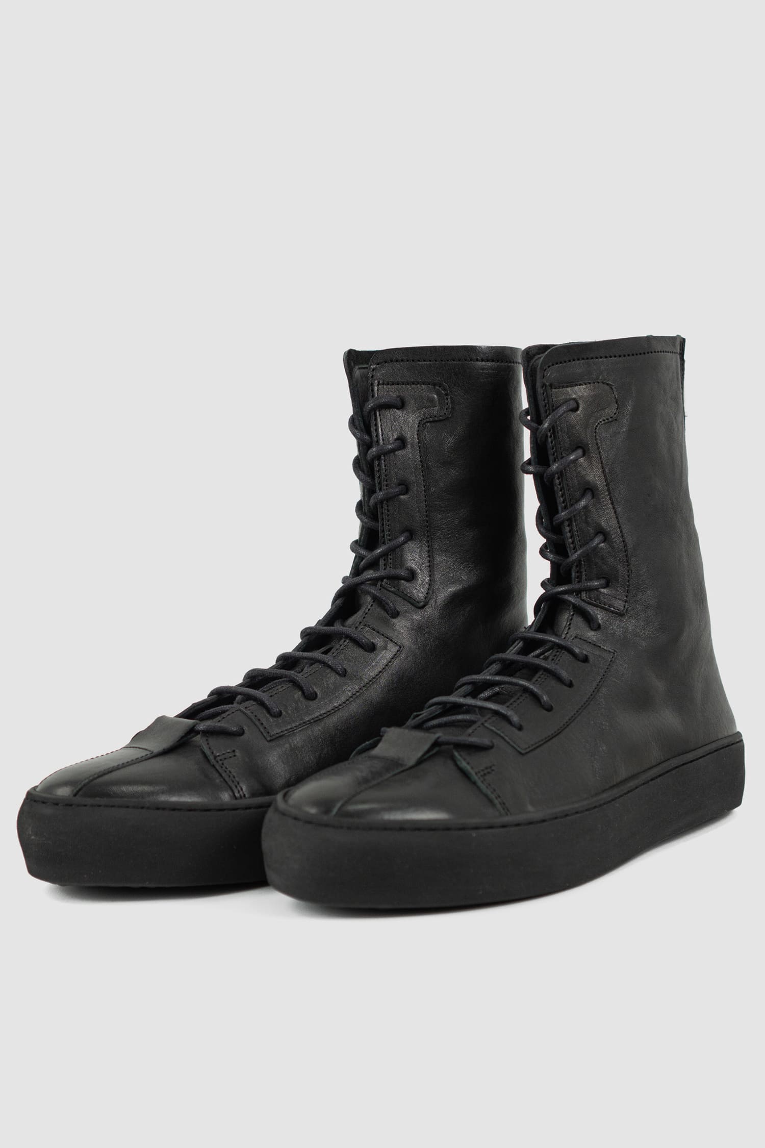 The Last Conspiracy - front left view of Black Leather High Top Sneaker for Men from SS24 Collection with Excella Back Zip Detail.
