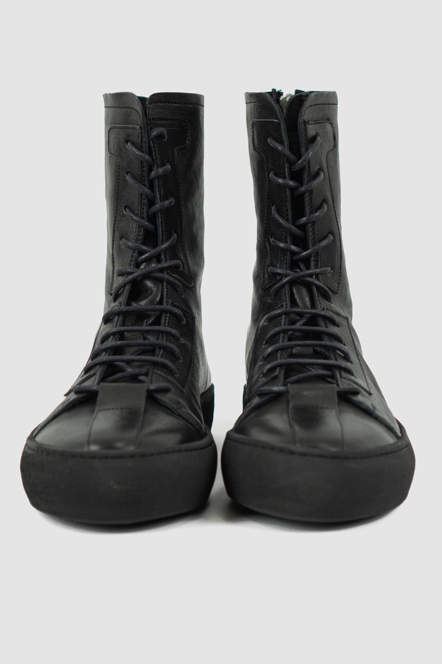The Last Conspiracy - front view of Black Leather High Top Sneaker for Men from SS24 Collection with Excella Back Zip Detail.