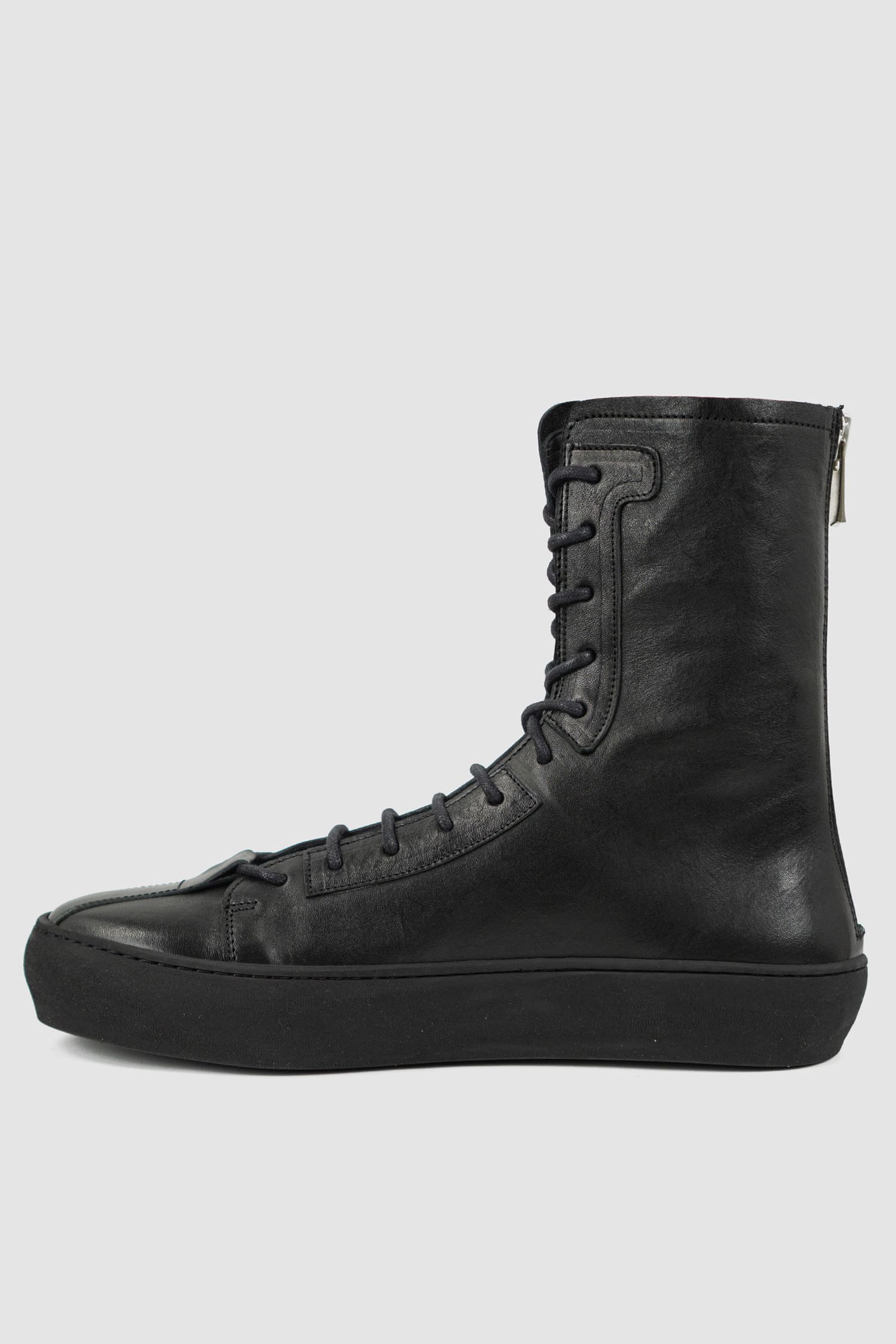 The Last Conspiracy - left view of Black Leather High Top Sneaker for Men from SS24 Collection with Excella Back Zip Detail.