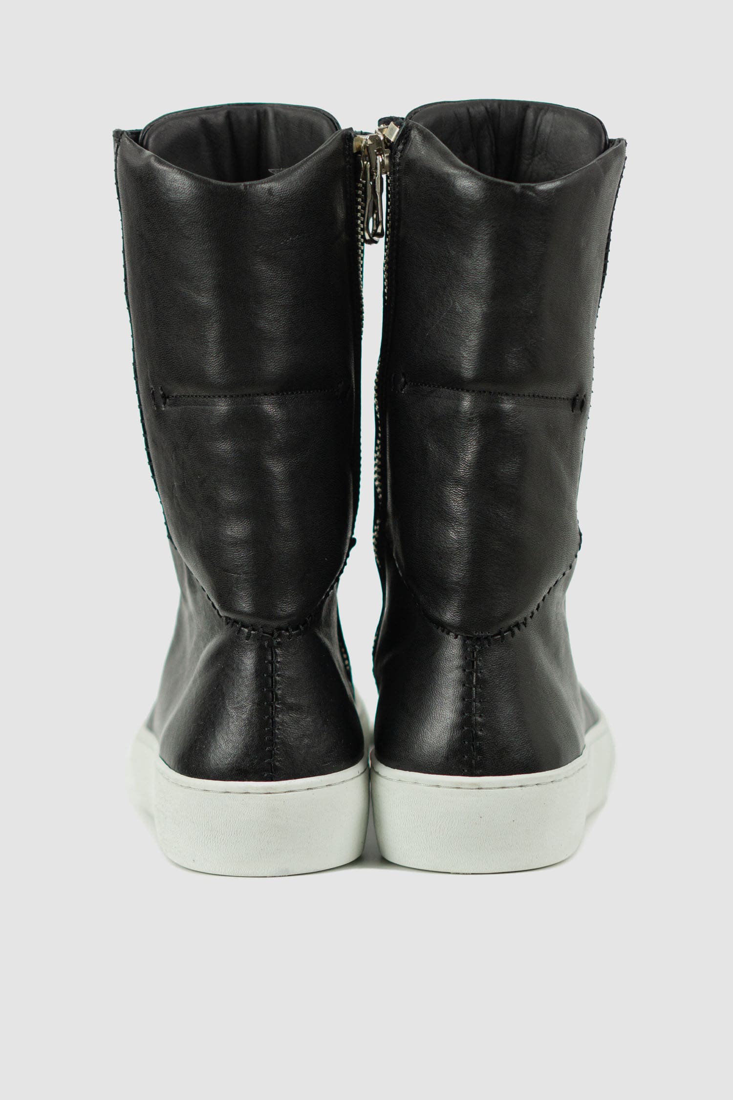 The Last Conspiracy - back view of Black Leather High Top Sneaker for Men from the Permanent Collection with Contrast Puffed Sole.