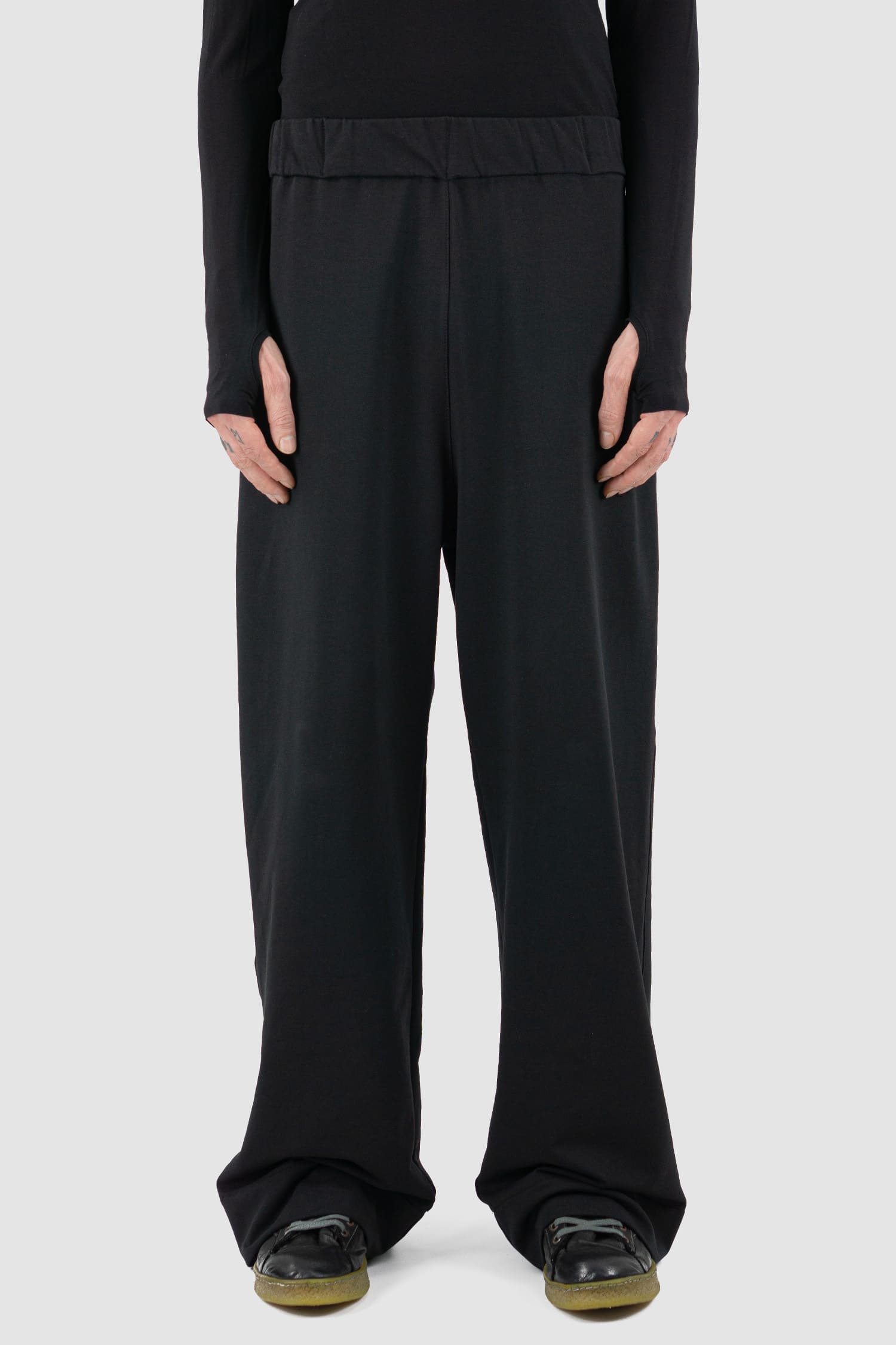 UY Studio - Front view of black cotton wide leg Gangster sweatpants with elastic waistband, clean edge hem, Permanent Collection.