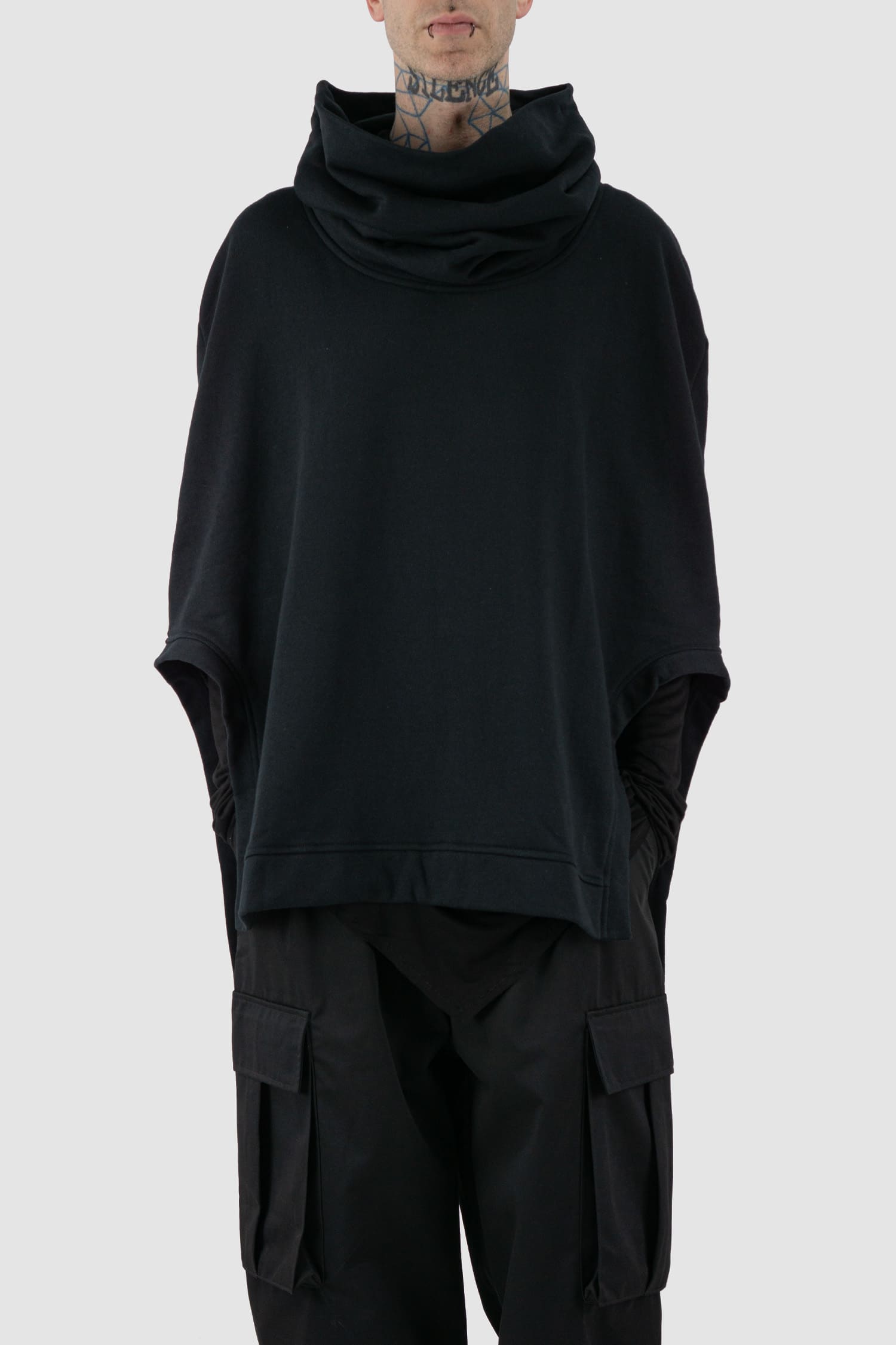 XConcept - Front legere view of black overlapping shoulder high neck top for men with asymmetrical cut, stand-up collar, thick cotton, FW24 Collection.