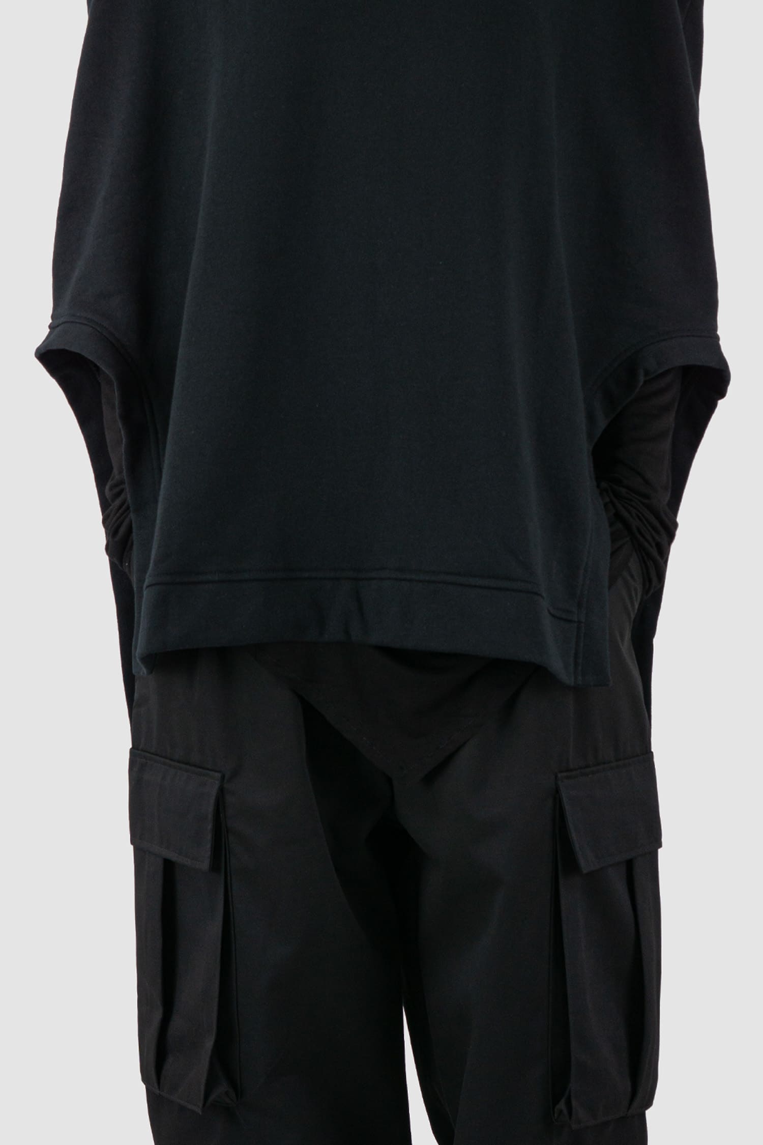 XConcept - panel view of black overlapping shoulder high neck top for men with asymmetrical cut, stand-up collar, thick cotton, FW24 Collection.