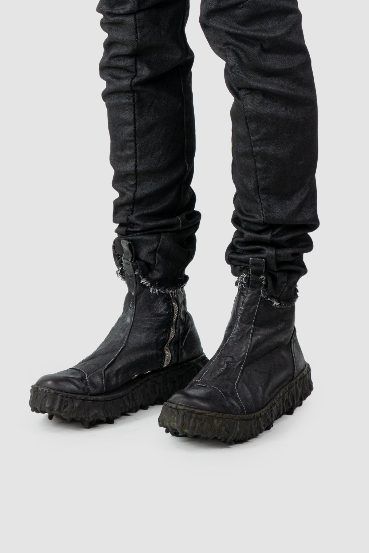 Culture of Brave - Men's Black Chelsea Leather Sneaker - Melt Seal - model left view Culture of Brave - Men's Black Chelsea Leather Sneaker - Melt Seal - model left view