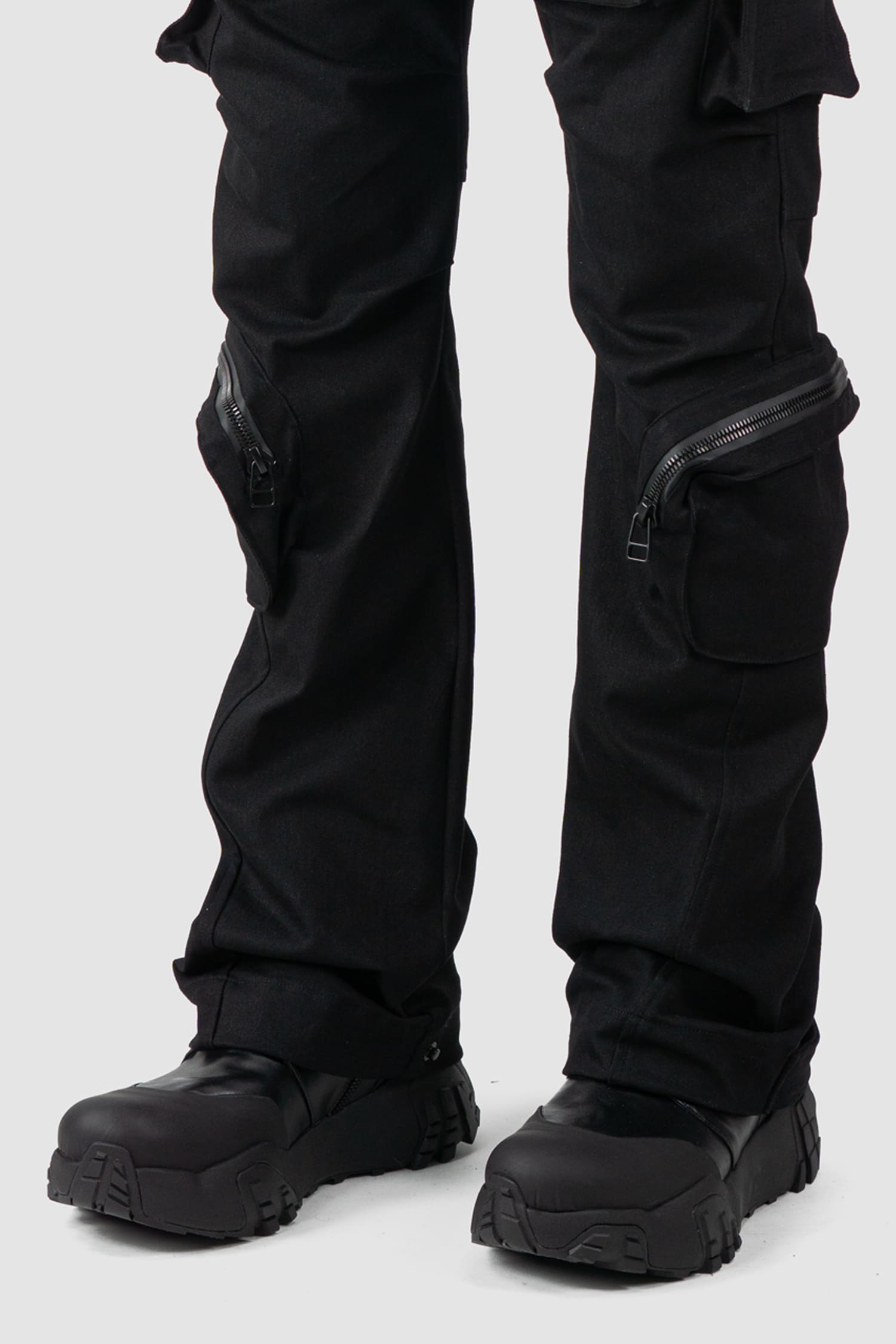 Gall Laboratories by Justin Gall - front hem detail view of black Unit Cotton Cargo Trousers