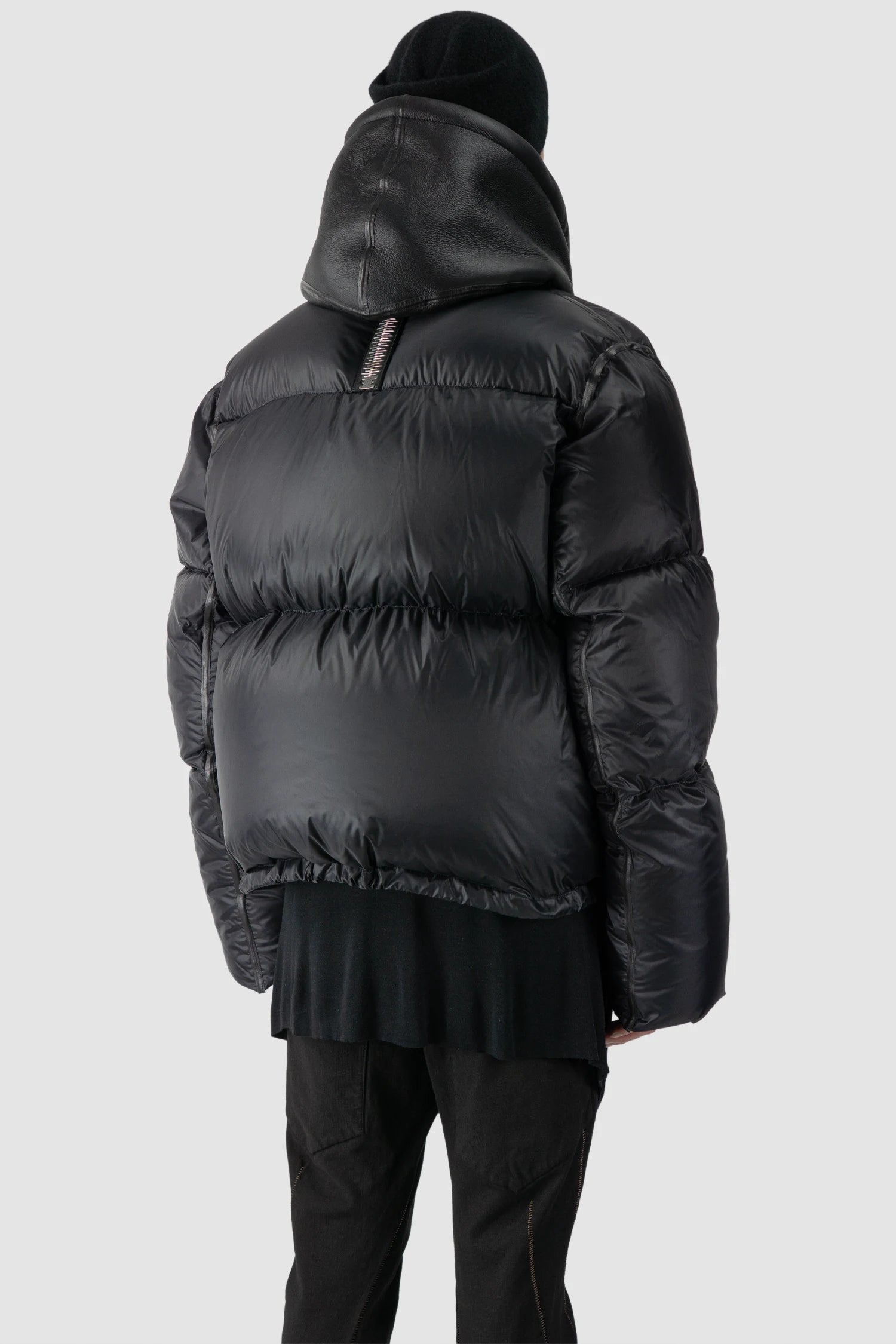 Isaac Sellam - model back side view of men’s Black Hooded Cropped Shearling and Down Puffer Jacket