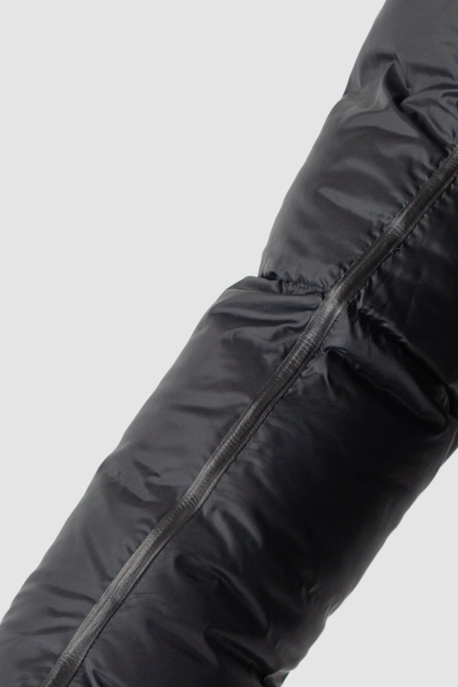 Isaac Sellam - arm detail view of men’s Black Shearling Leather and Down Cropped Puffer Jacket