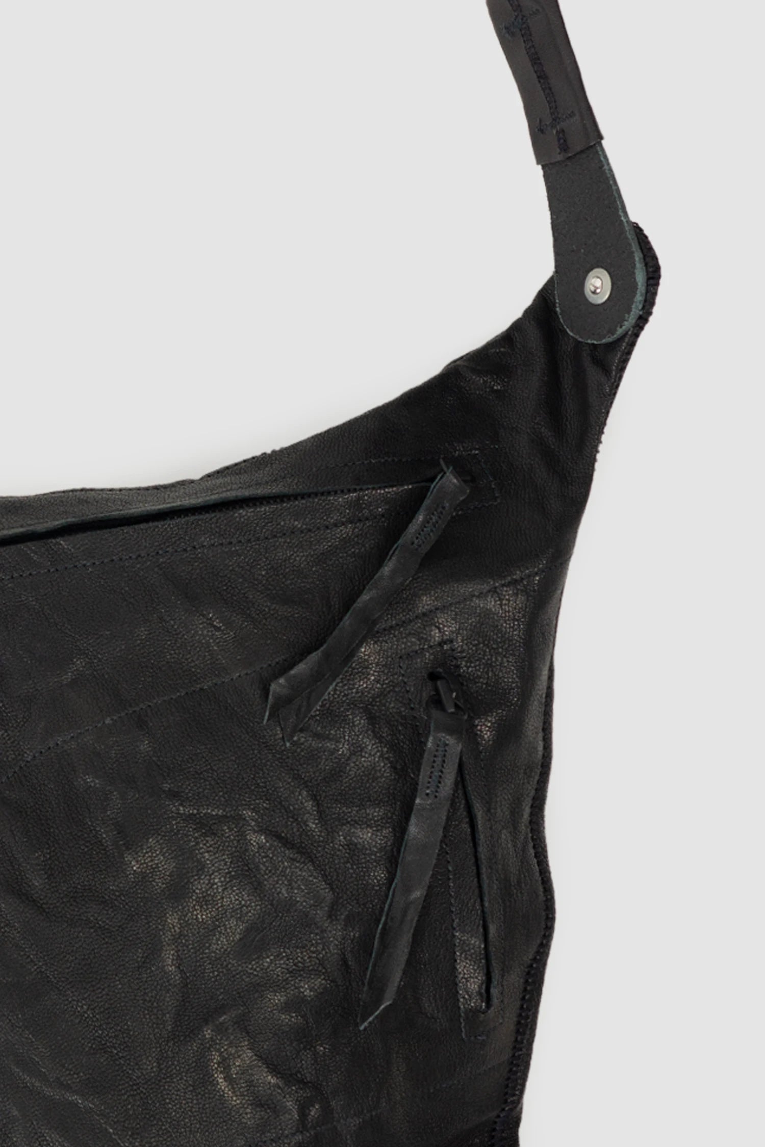 Isaac Sellam Experience - Nomade Men’s Black Asymmetric Lamb Leather Crossbody Bag zipper detail view