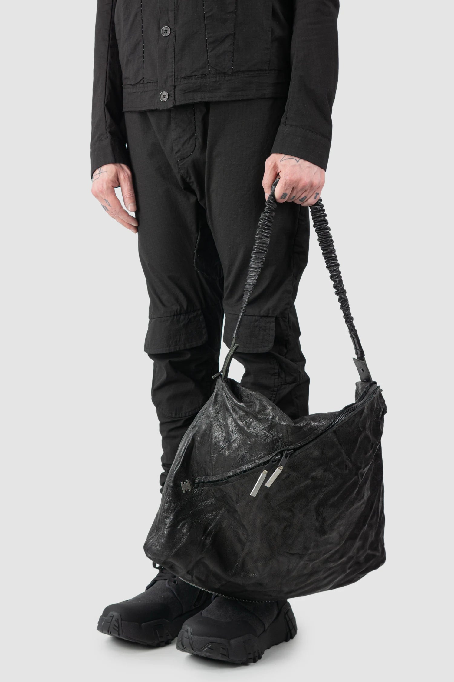 Isaac Sellam Experience - Balladeur Men’s Black Large Asymmetric Lamb Leather Shoulder Bag model hand hold view