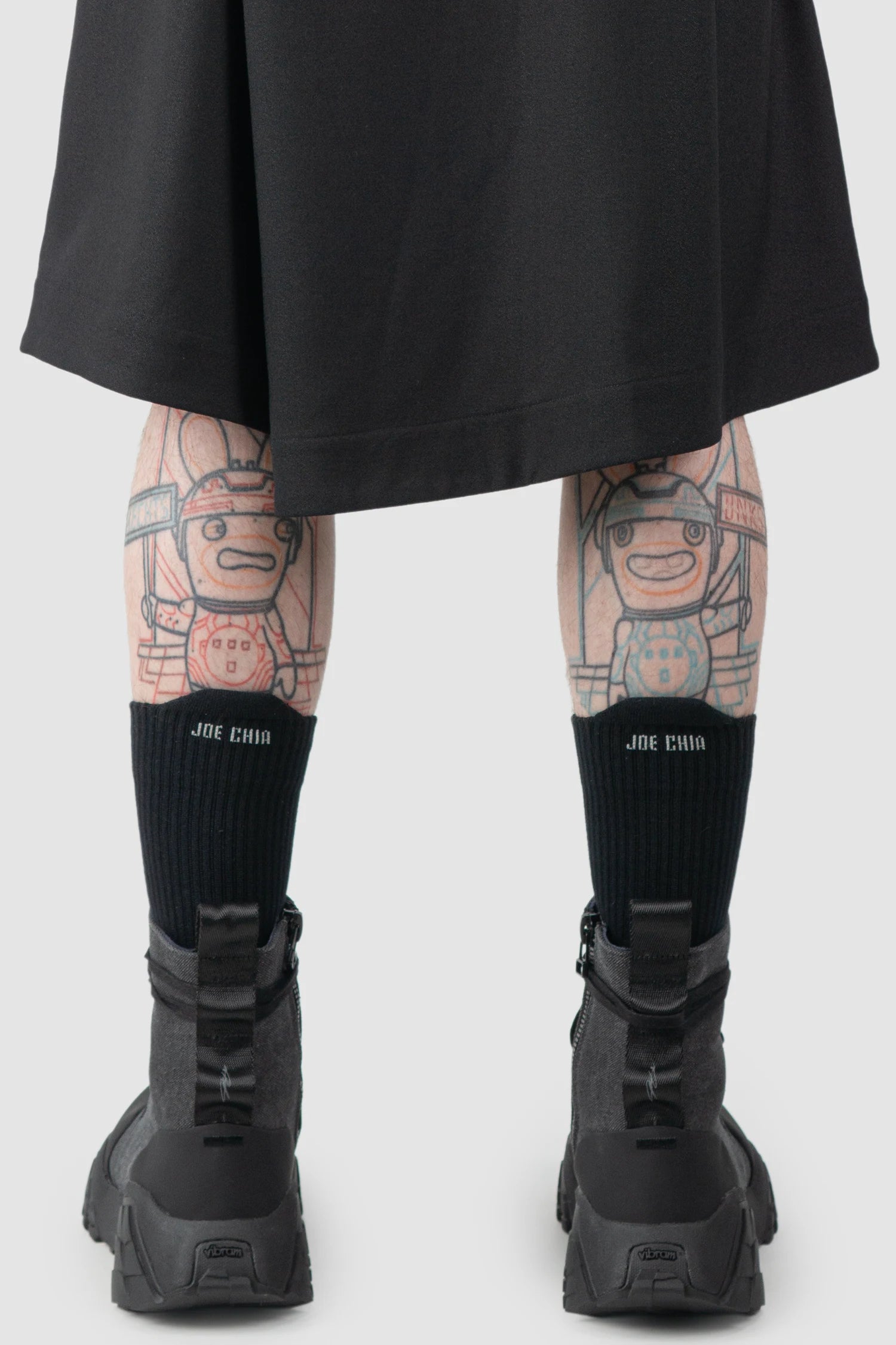 Joe Chia - Men’s Black Calf High Cotton Blend Logo Socks model back view