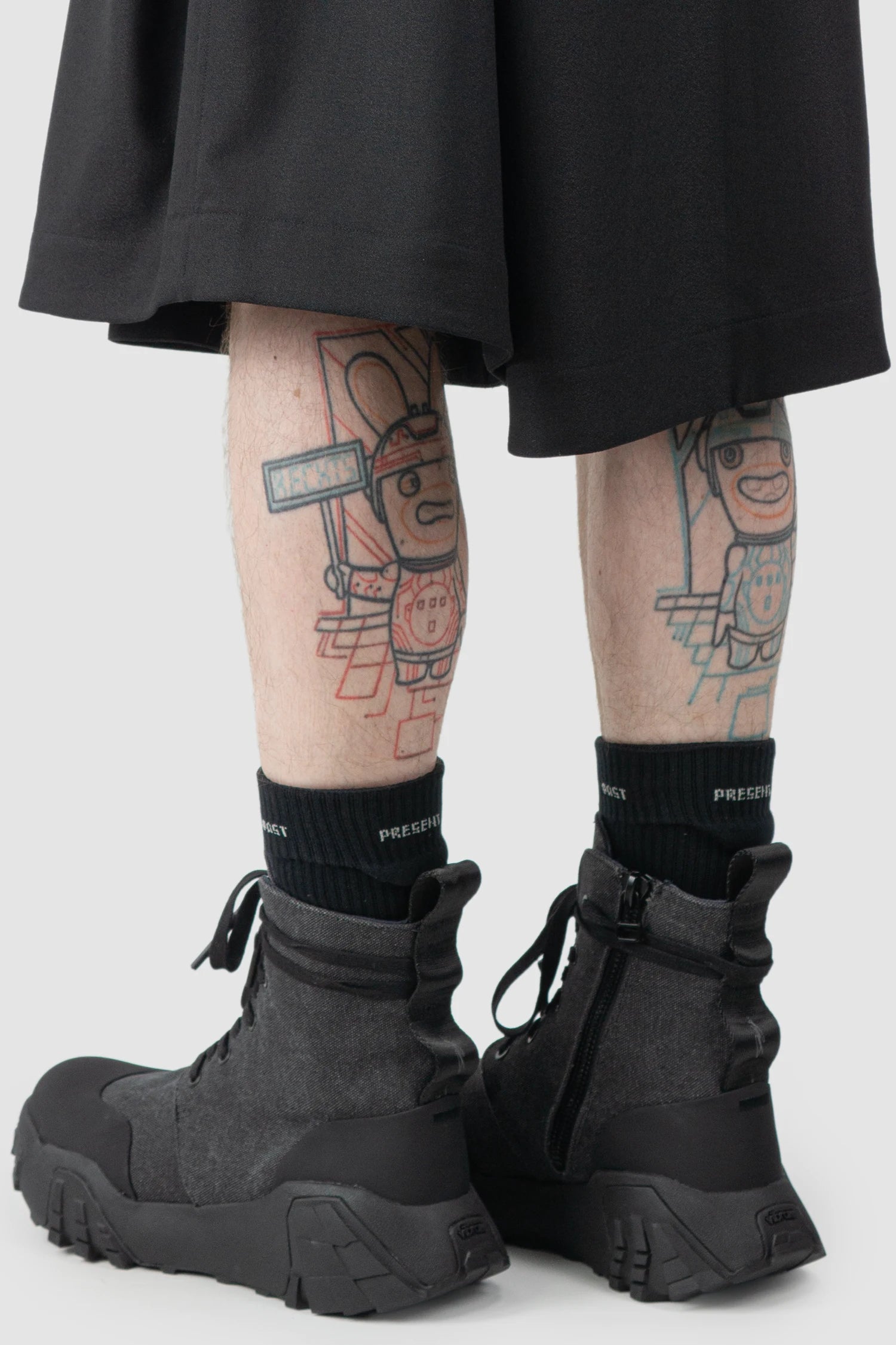 Joe Chia - Men’s Black Calf High Cotton Blend Logo Socks model side rolled view