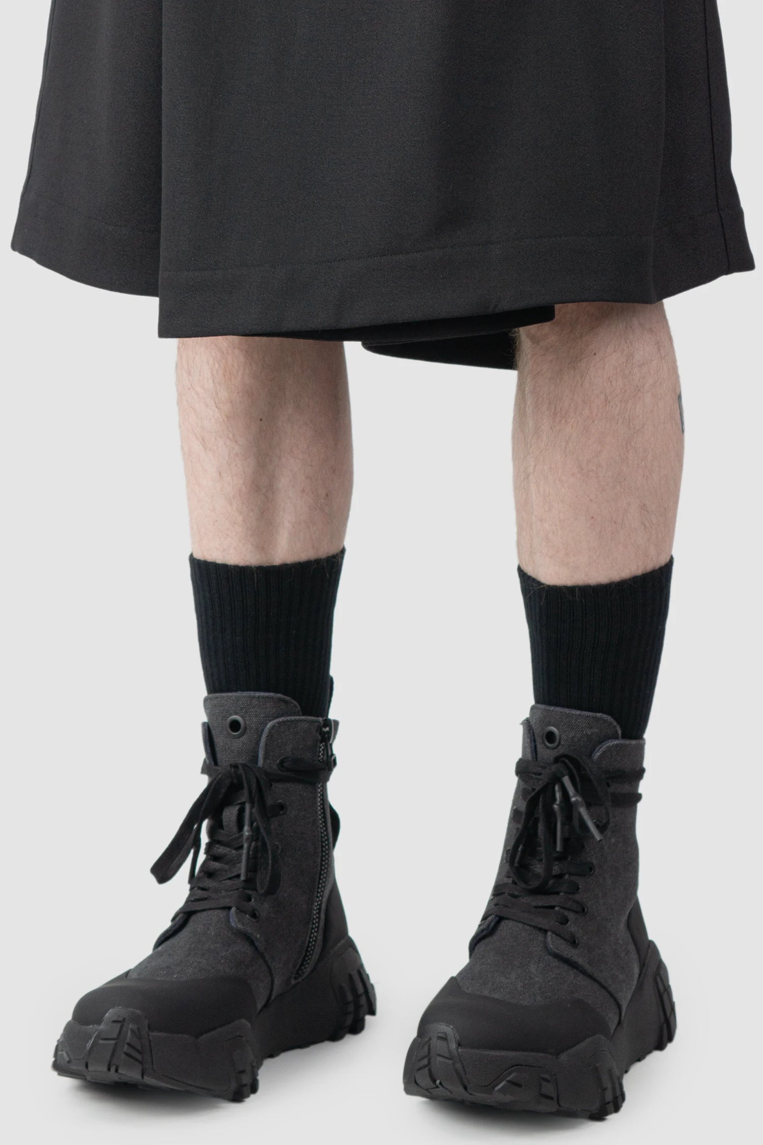 Joe Chia - Men’s Black Wool Linen Skirt Panel Wide Shorts hem detail view
