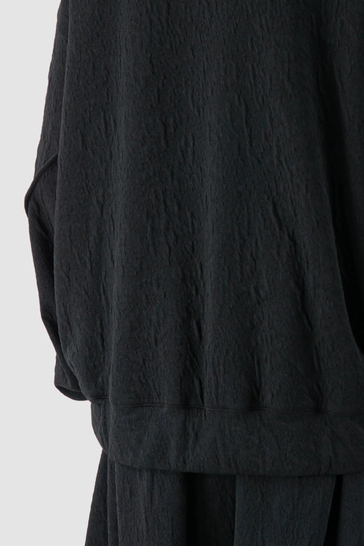 La Haine Inside Us - Men's Black High Neck Embossed Sweater - hem detail view La Haine Inside Us - Men's Black High Neck Embossed Sweater - hem detail view