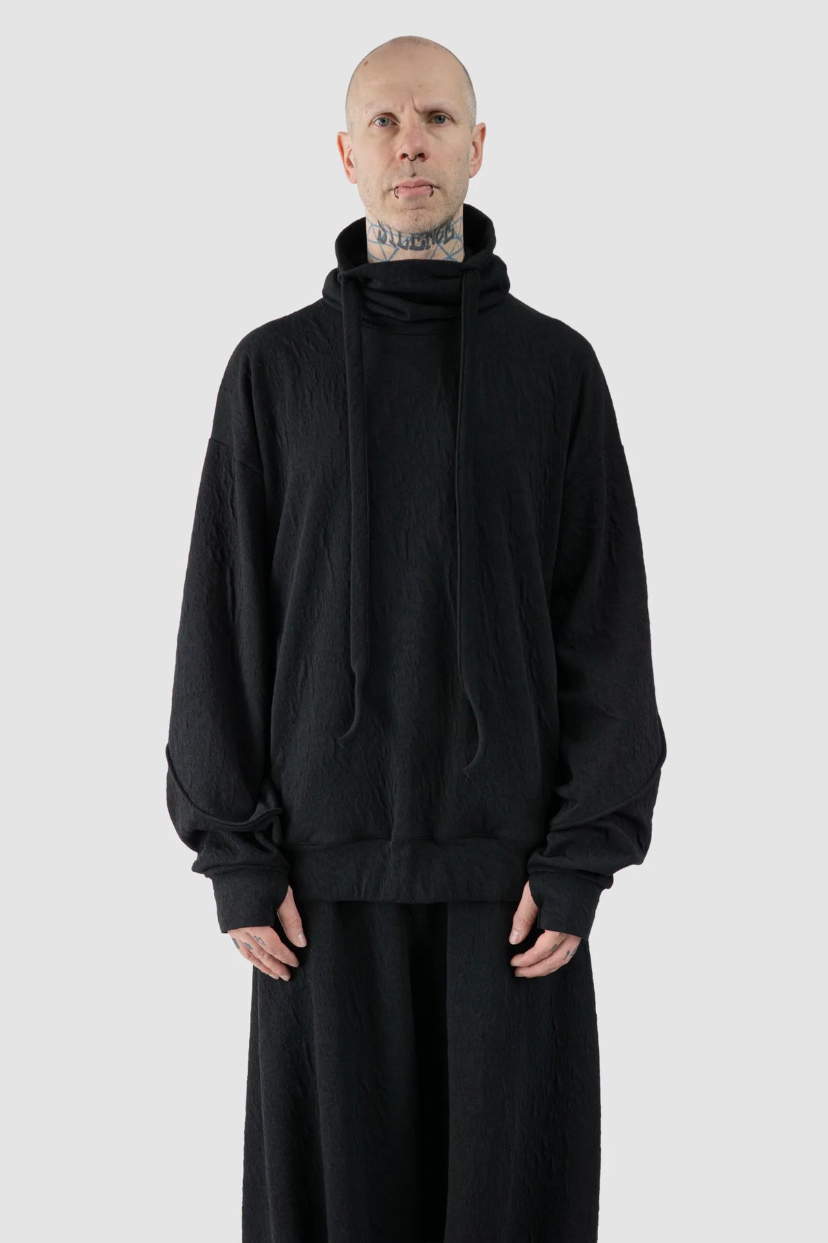 La Haine Inside Us - Men's Black High Neck Embossed Sweater - model front view - MONO-KROM | Gallery La Haine Inside Us - Men's Black High Neck Embossed Sweater - model front view - MONO-KROM | Gallery