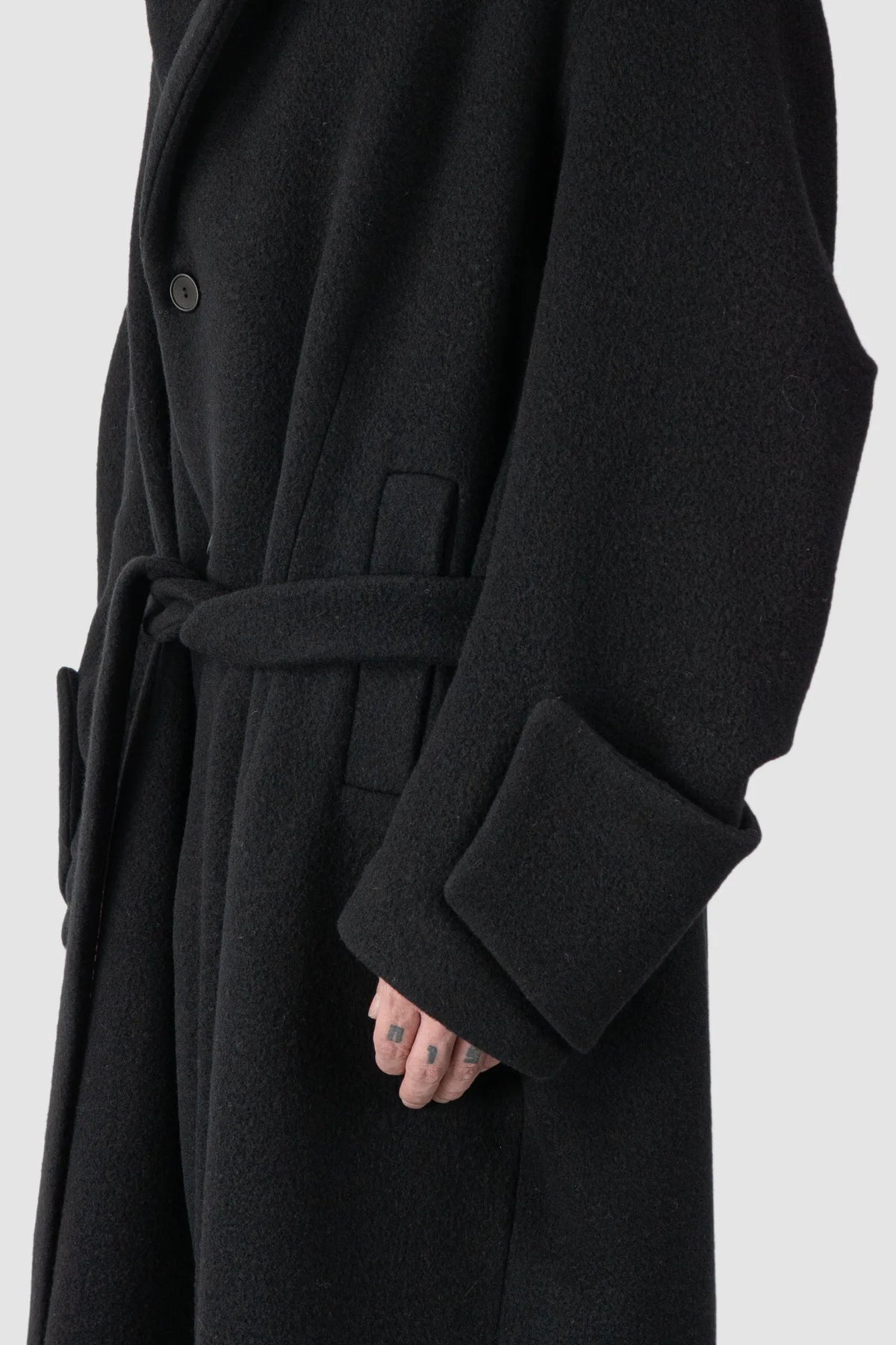 La Haine Inside Us - Men's Black Jumbo Soft Wool Blend Trench Coat - arm detail view La Haine Inside Us - Men's Black Jumbo Soft Wool Blend Trench Coat - arm detail view