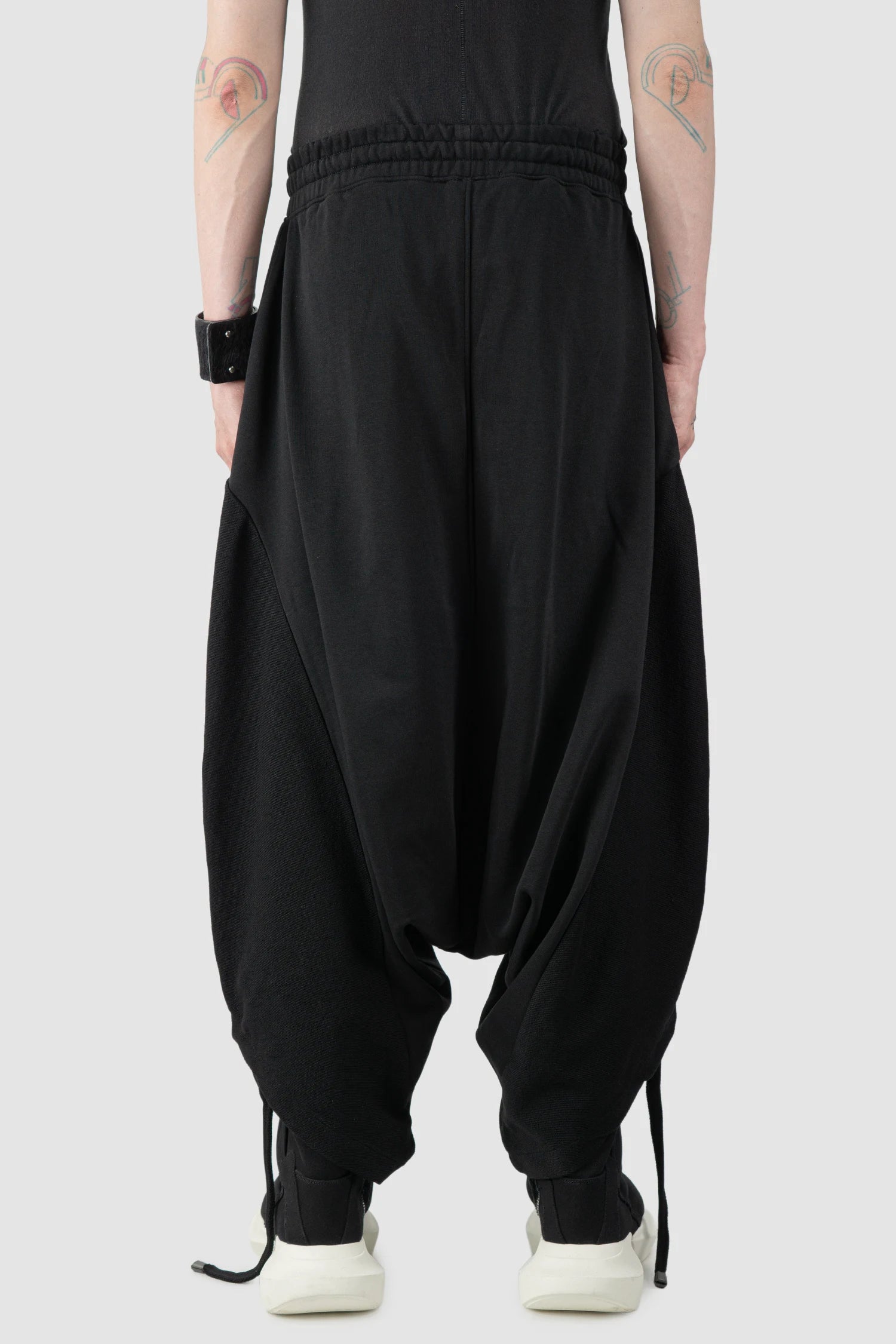 La Haine Inside Us - Men's Black Structured Baggy Cotton Fleece Pants - model back view La Haine Inside Us - Men's Black Structured Baggy Cotton Fleece Pants - model back view