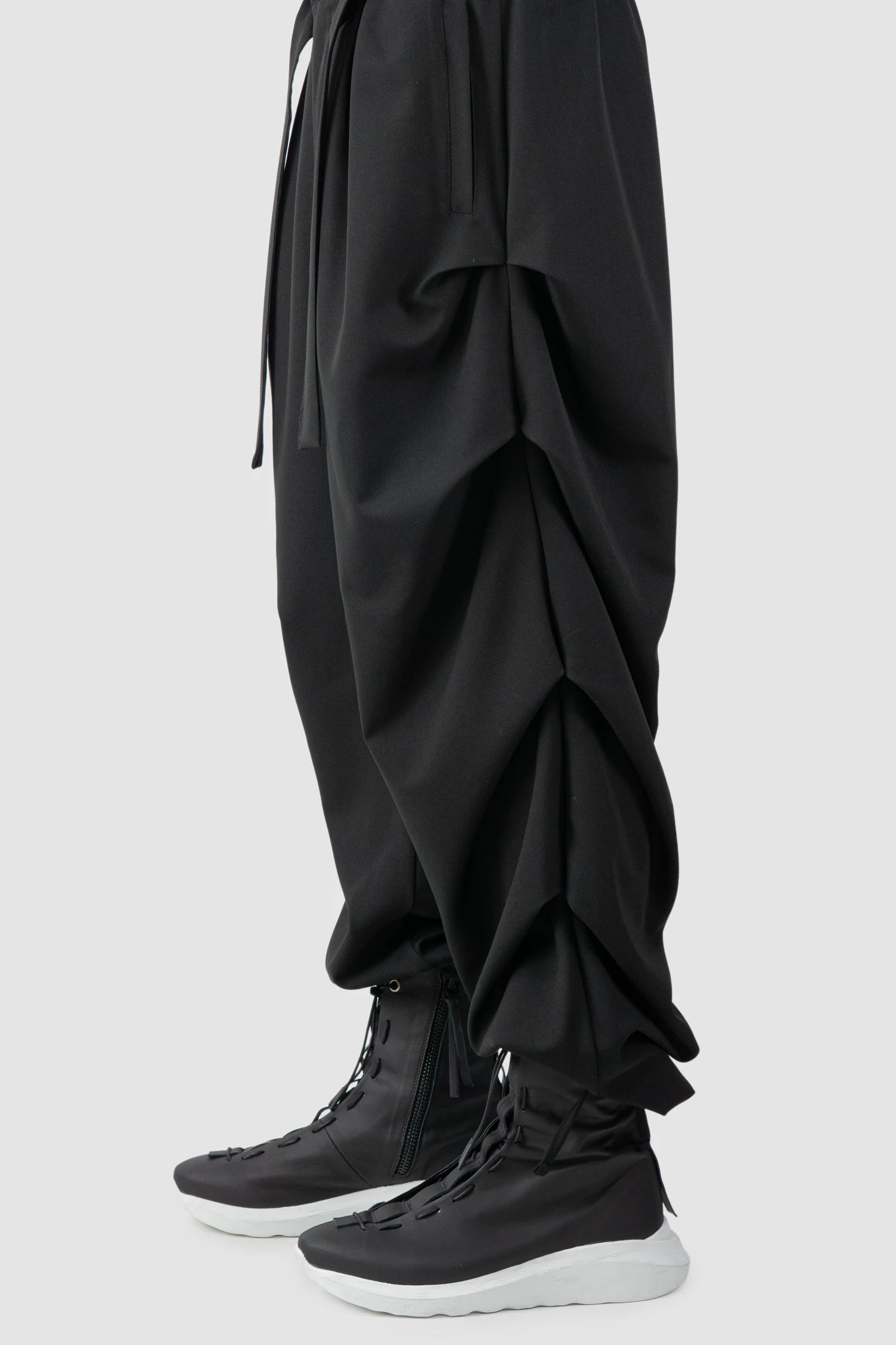 La Haine Inside Us - Men’s Black Guttered Fluid Stretch Trousers leg detail view