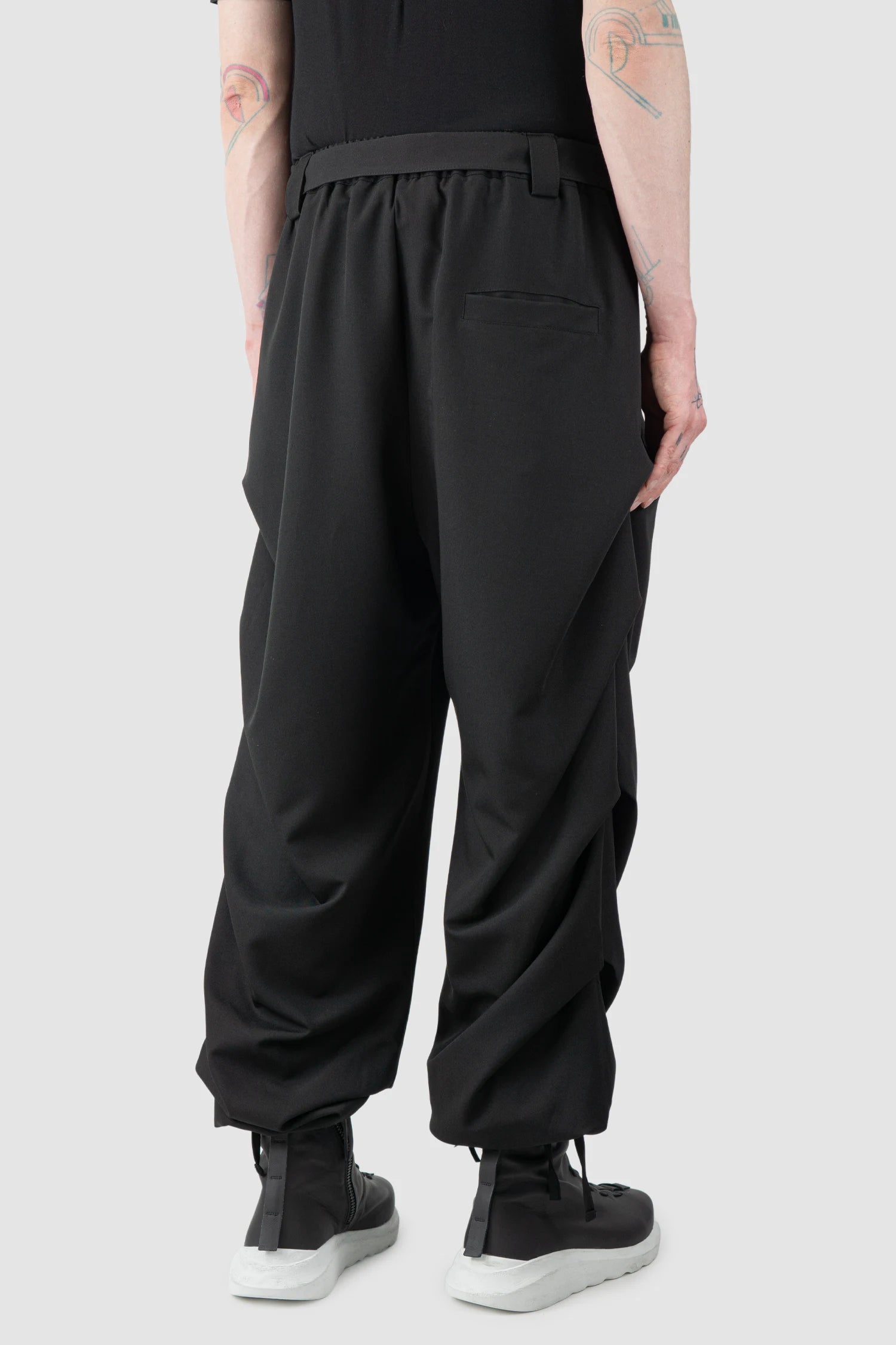 La Haine Inside Us - Men’s Black Guttered Fluid Stretch Trousers model back side view