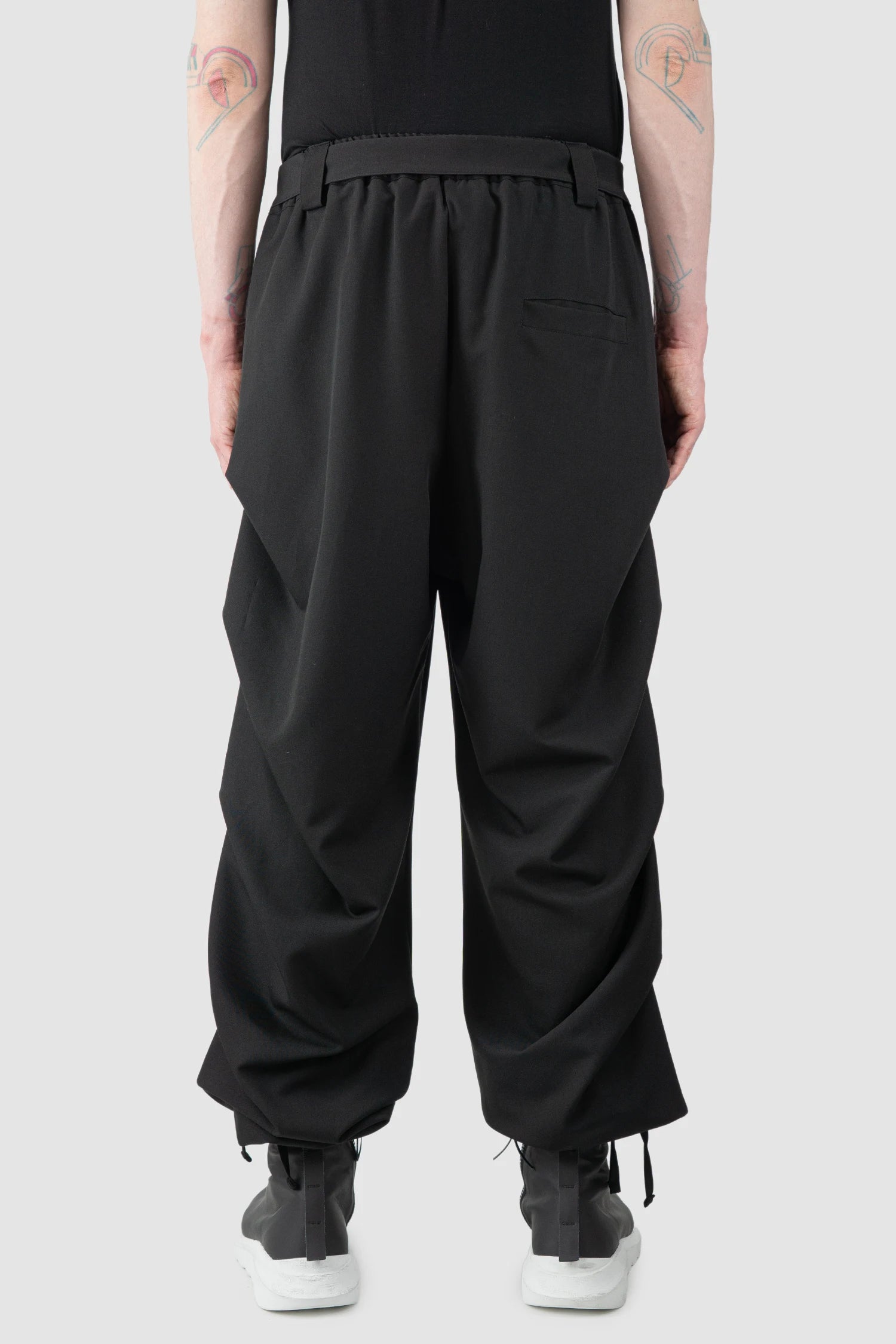 La Haine Inside Us - Men’s Black Guttered Fluid Stretch Trousers model back view