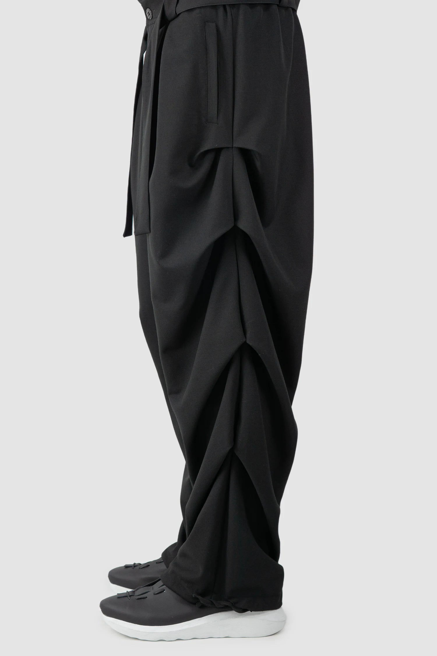 La Haine Inside Us - Men’s Black Guttered Fluid Stretch Trousers ope leg side view