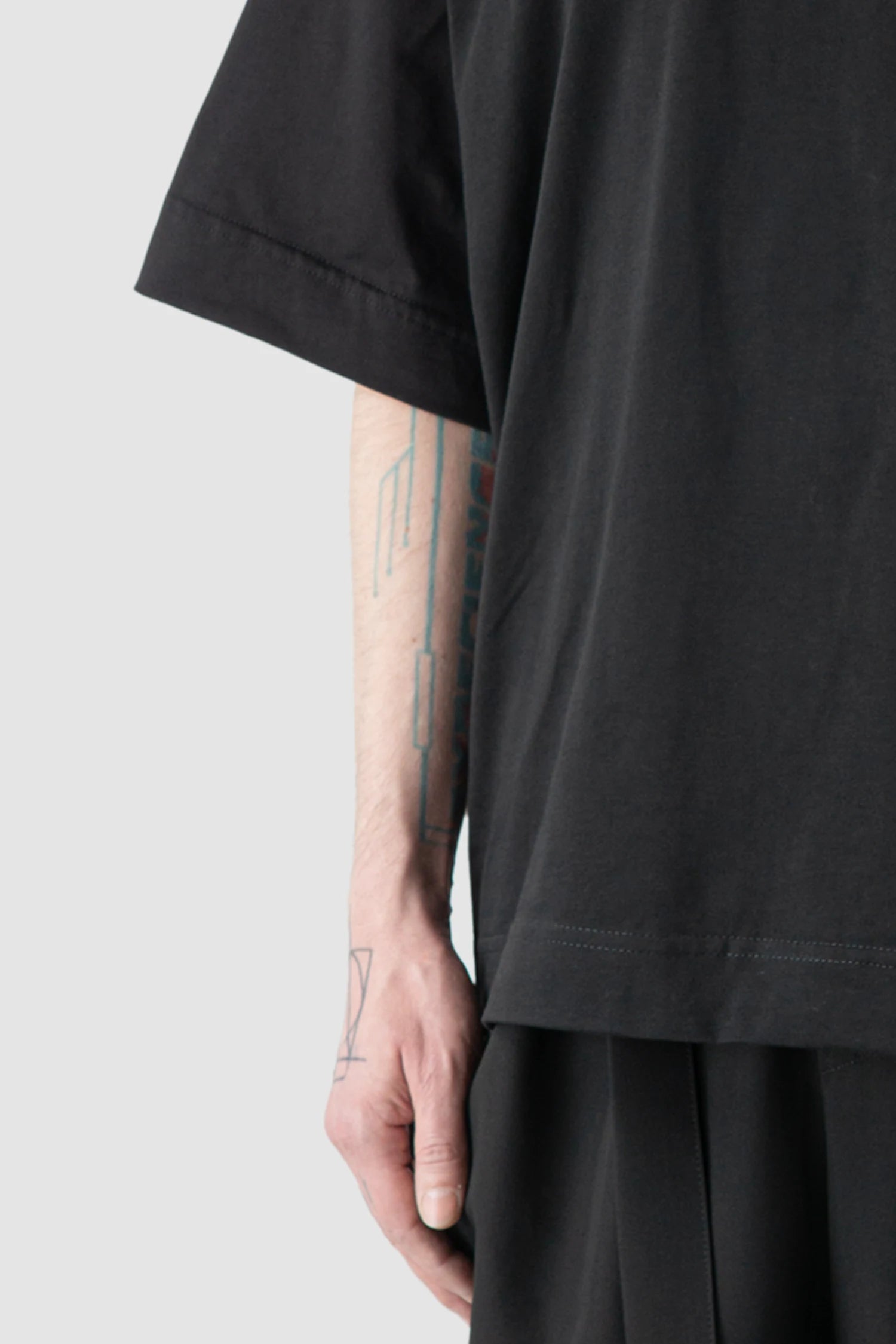La Haine Inside Us - Men’s Black Oversized Pocket T-Shirt hem detail view