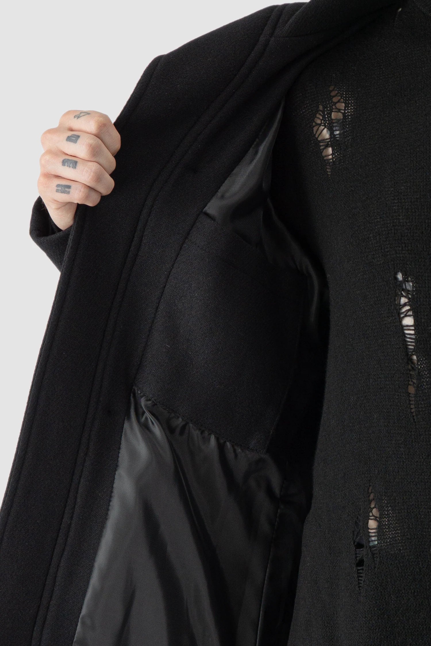 La Haine Inside Us - inner pocket view of men’s FW25 Black Asymmetric Draped High Collar Wool Jacket
