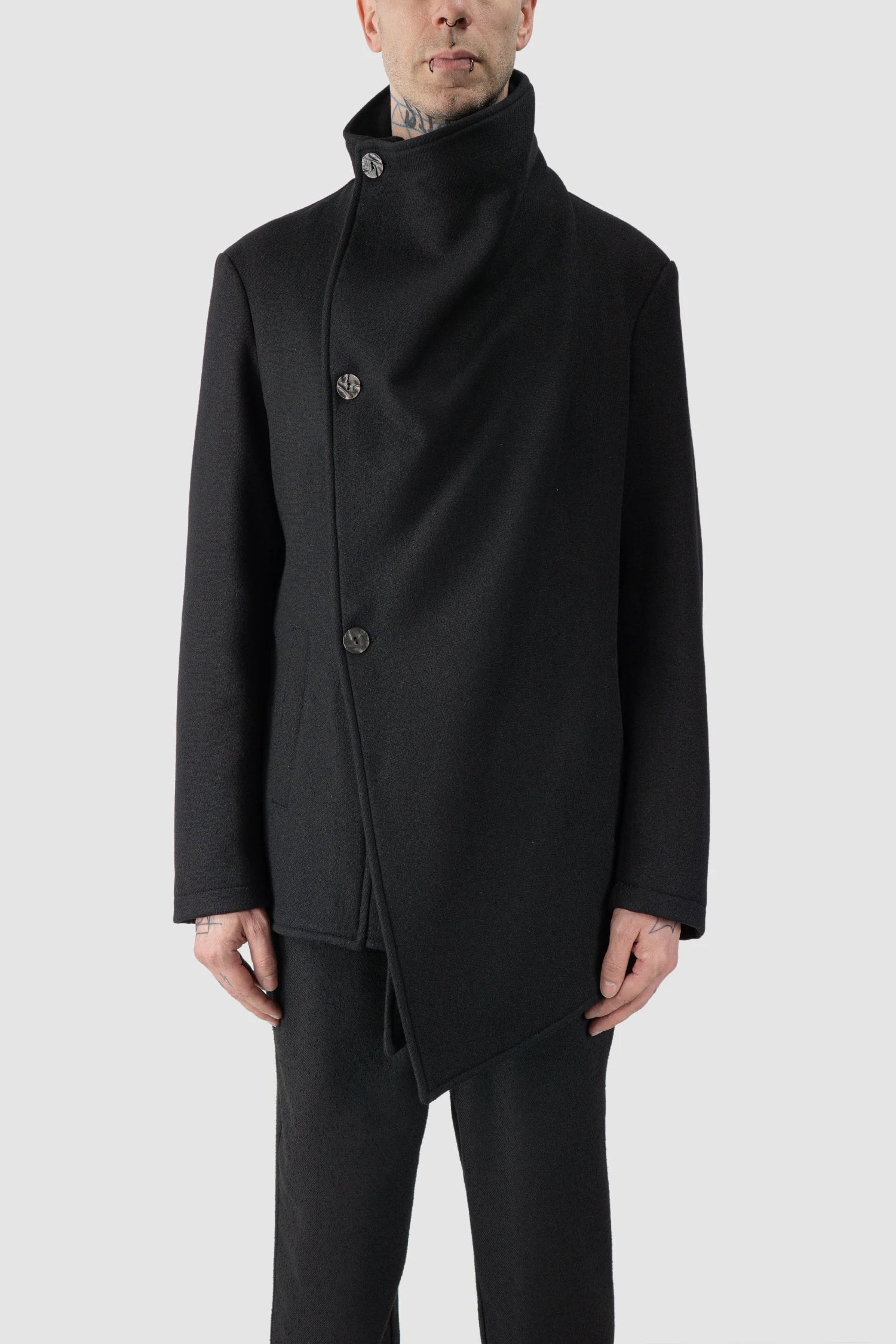 La Haine Inside Us - model front view of men’s FW25 Black Asymmetric Draped High Collar Wool Jacket