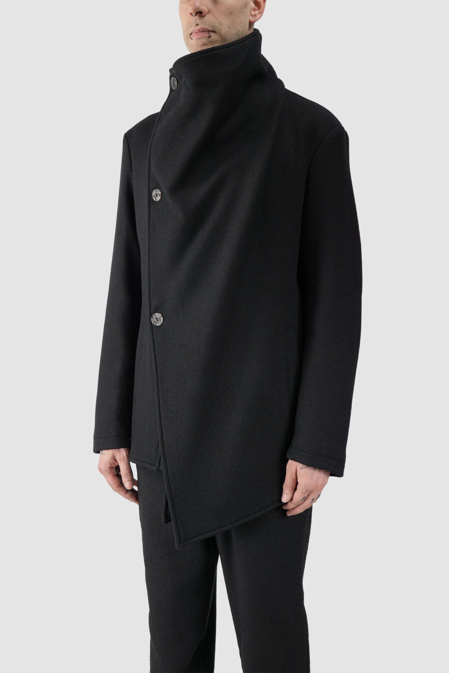 La Haine Inside Us - model front side view of men’s FW25 Black Asymmetric Draped High Collar Wool Jacket